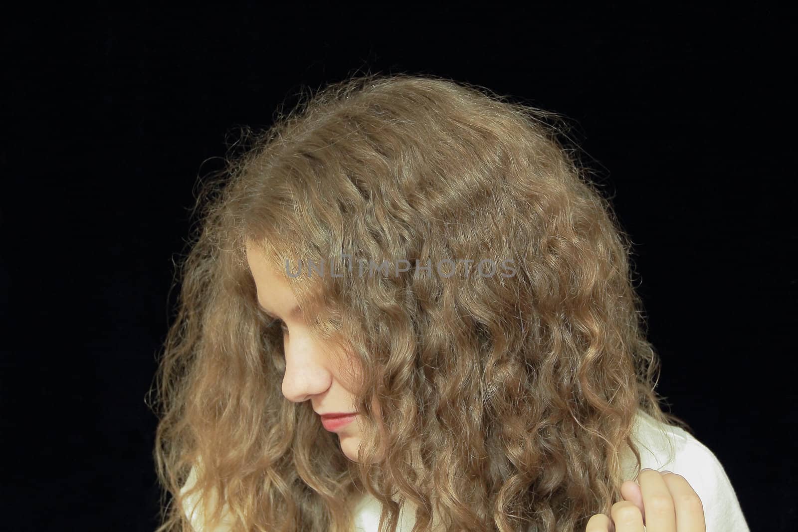 Portrait of young woman with long brown nature hair