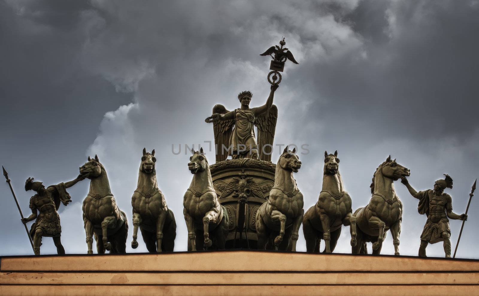 The sculpture of horses on the triumphal arch of St. Petersburg in the sky