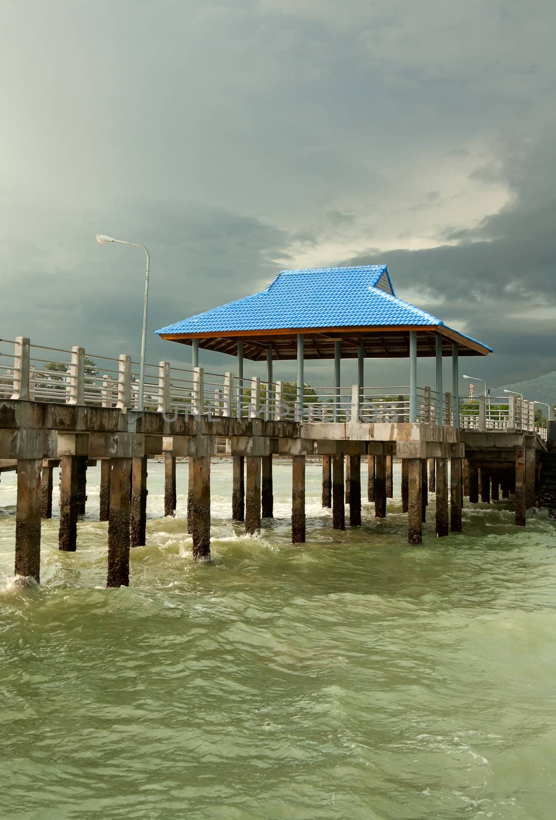 pier on piles against overcast sky