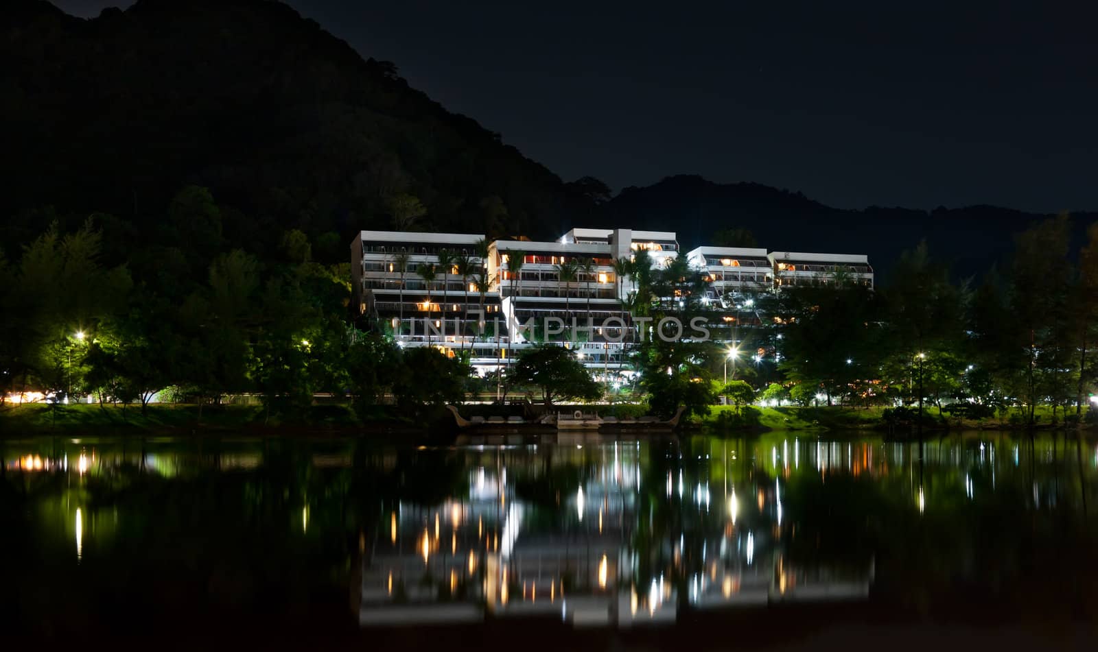 hotel at night, the reflection in the sea