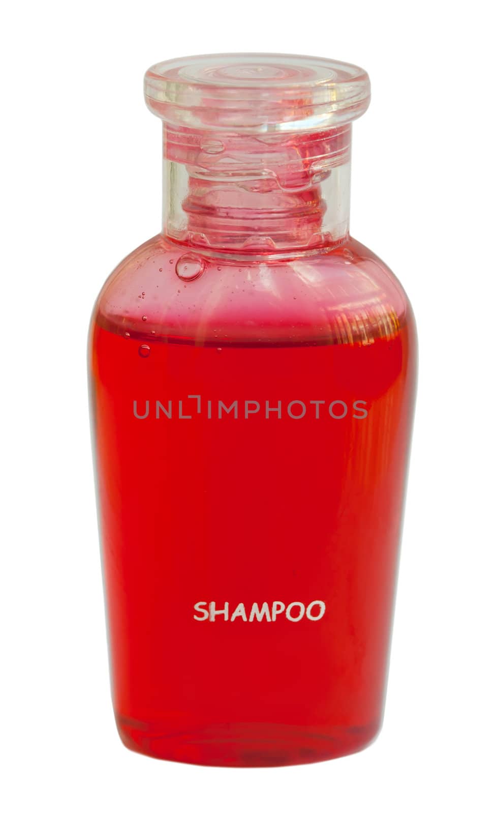 Small red bottle of shampoo isolated on white background