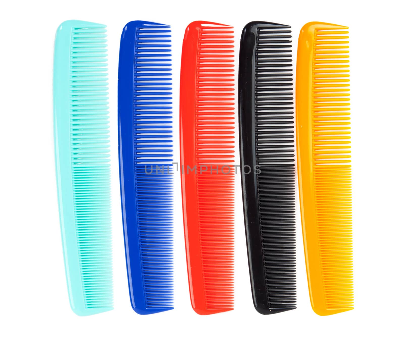 colored plastic comb isolated on white background