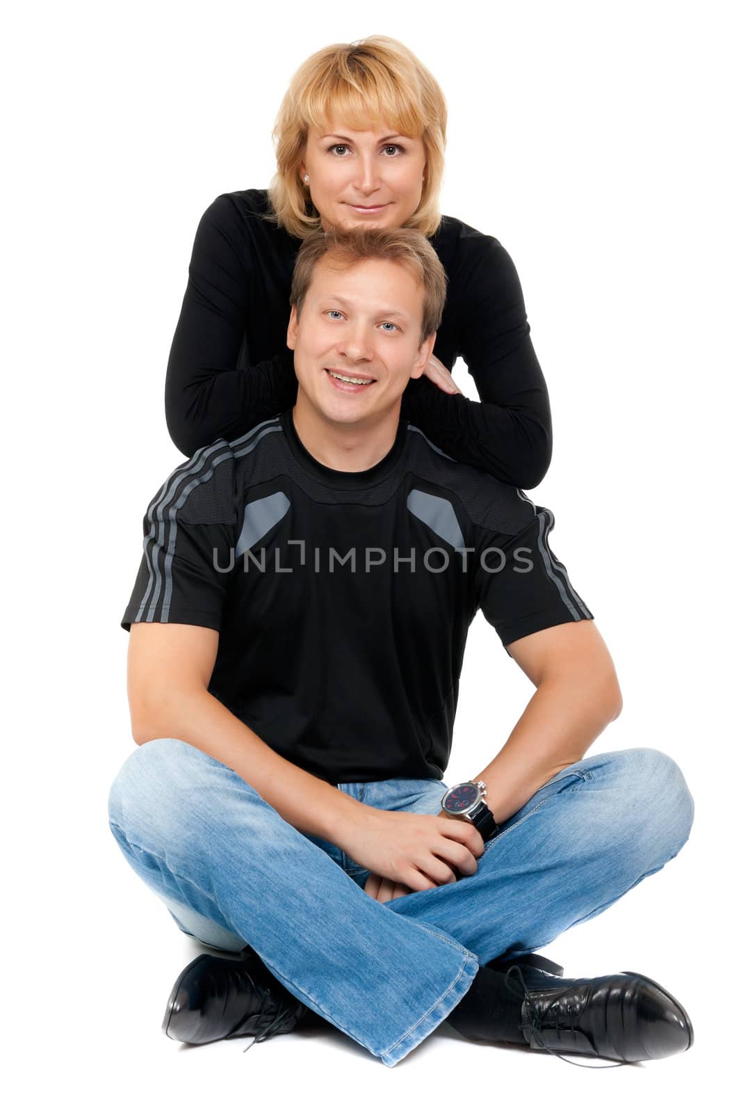 Beautiful couple in love sitting in the lotus position, isolate on white