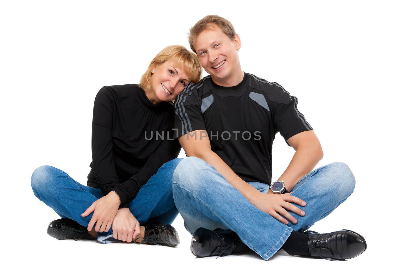 Beautiful couple in love sitting in the lotus position, isolate on white