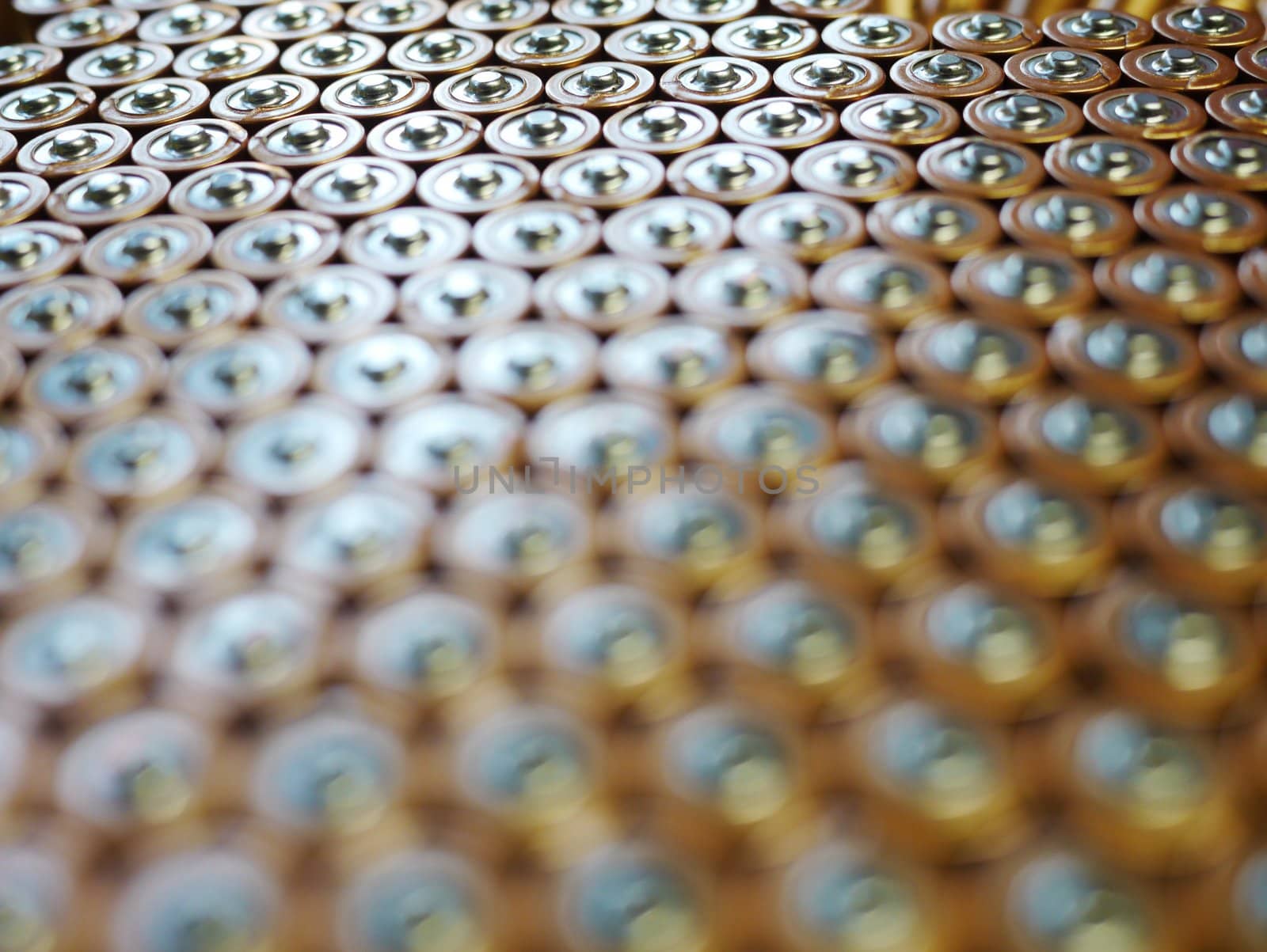 Several AA batteries in perspective closeup view