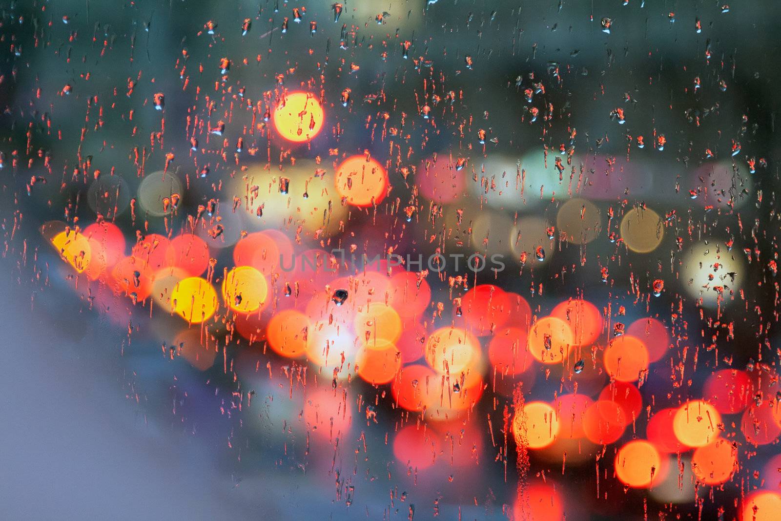 City at night in a glass with drops
