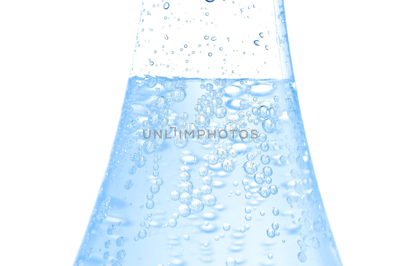 Bottle of water with bubbles on white background