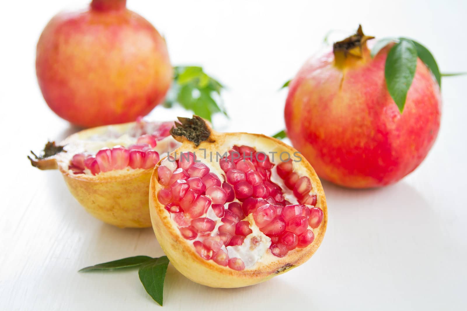 Fresh whole and halve Pomegranate