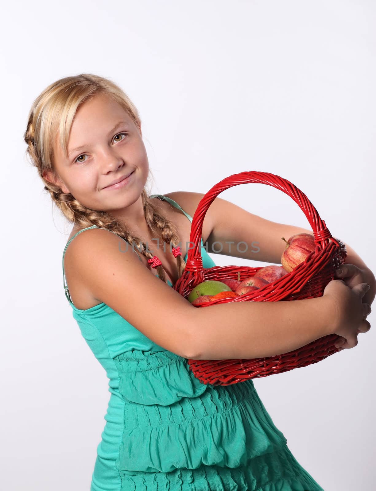 Beautiful girl with a basket of  Apples