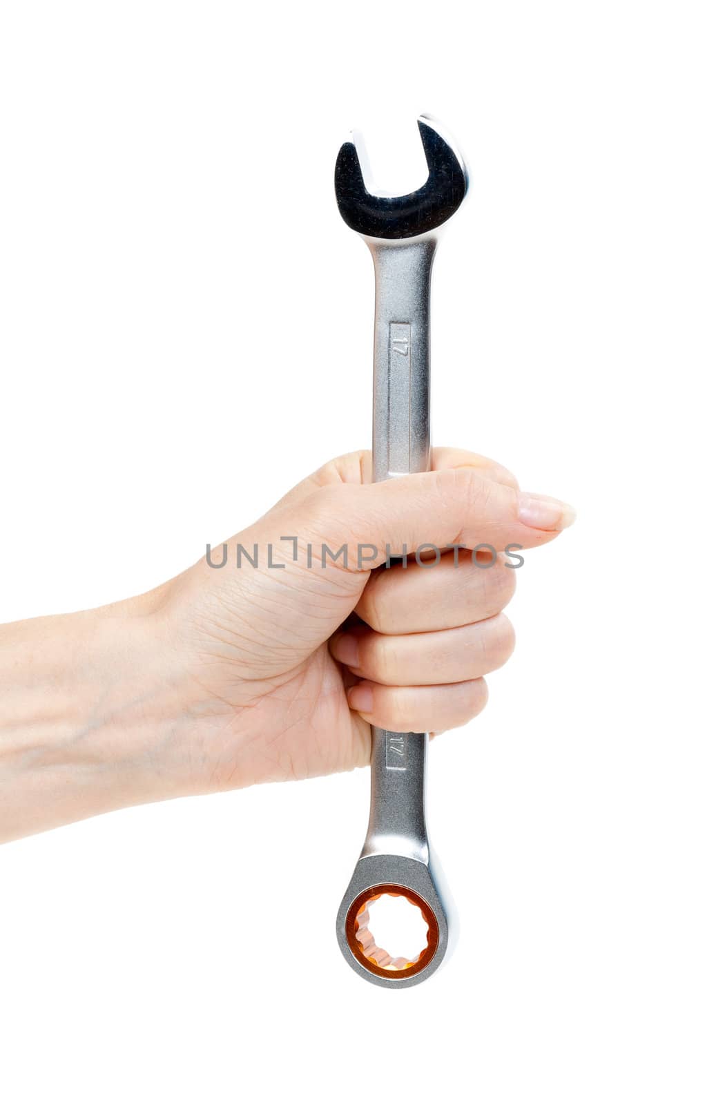 Woman's hand holding a chrome wrench. Isolate on white.