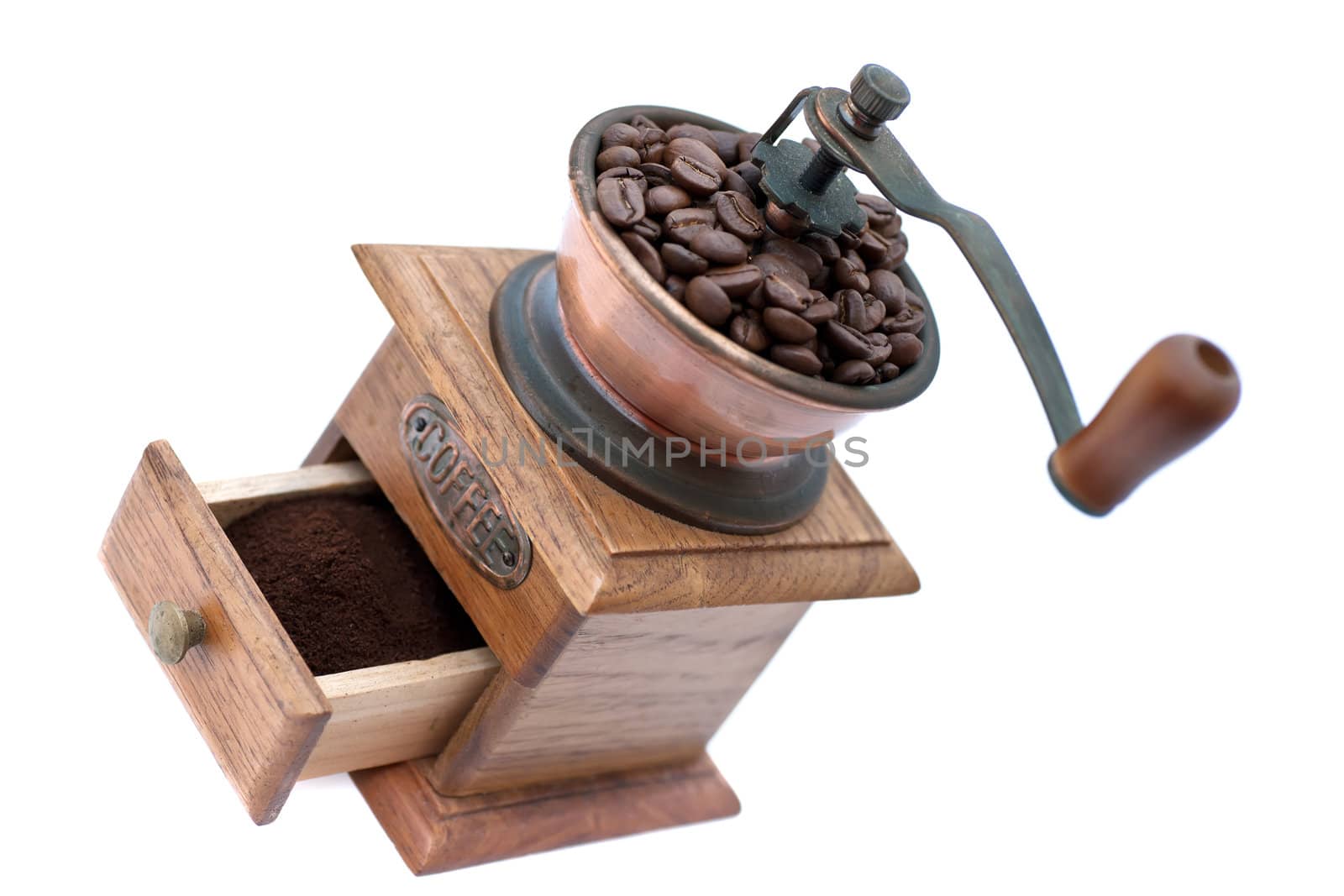 Old coffee grinder with beans