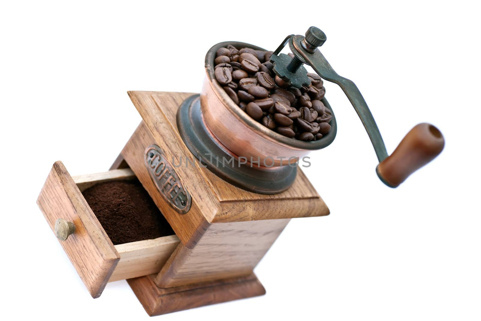 Old coffee grinder with beans