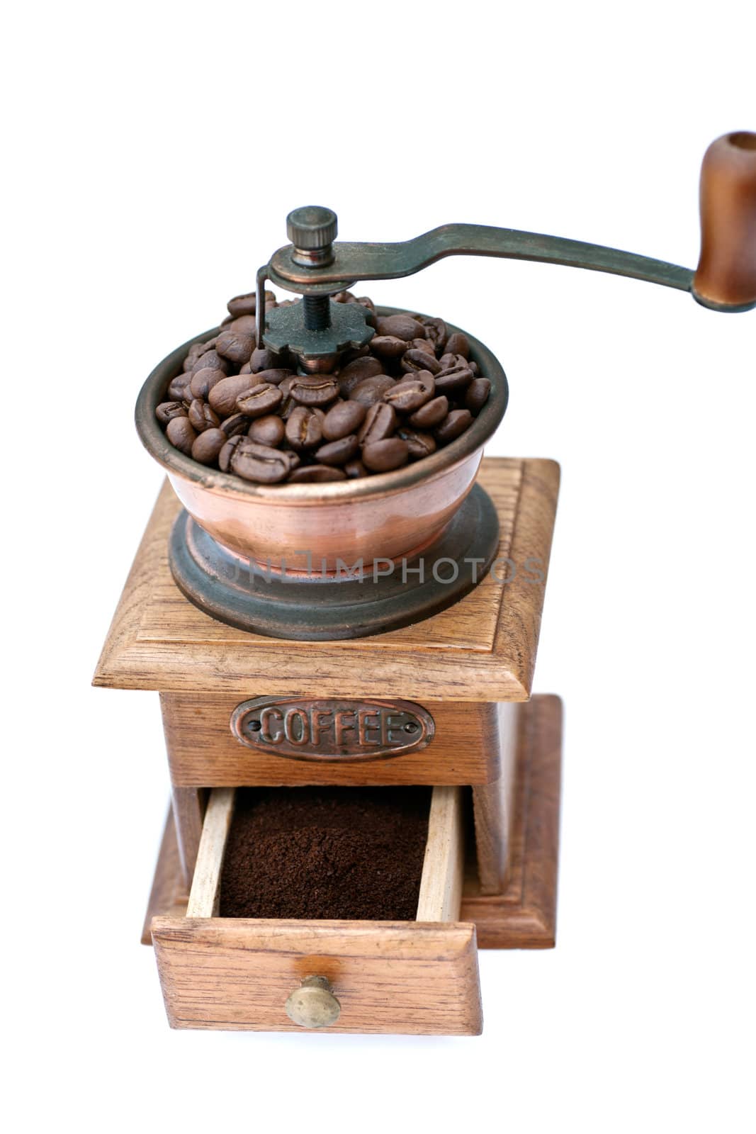 Old coffee grinder with beans