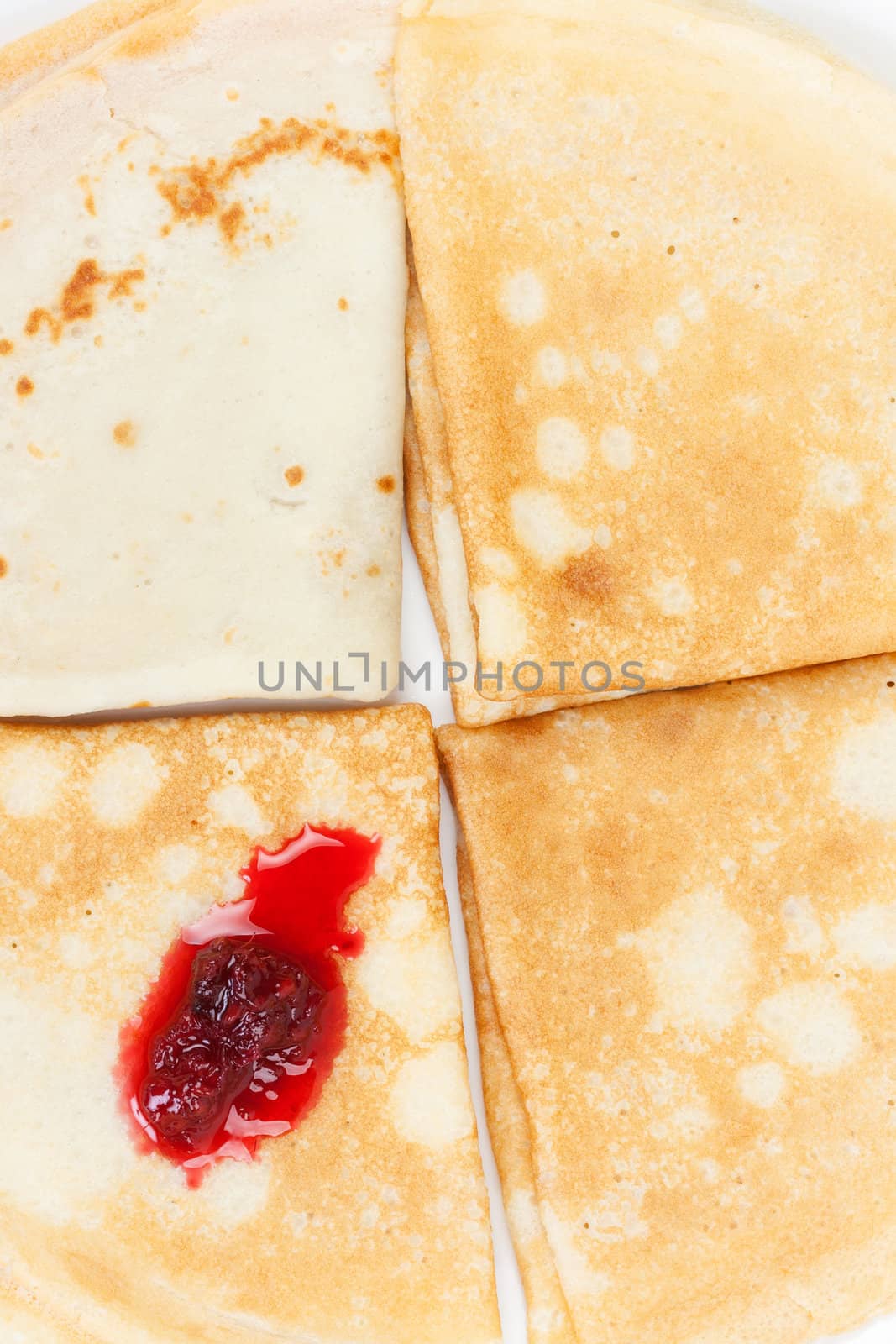 Fresh hot pancakes with raspberry jam
