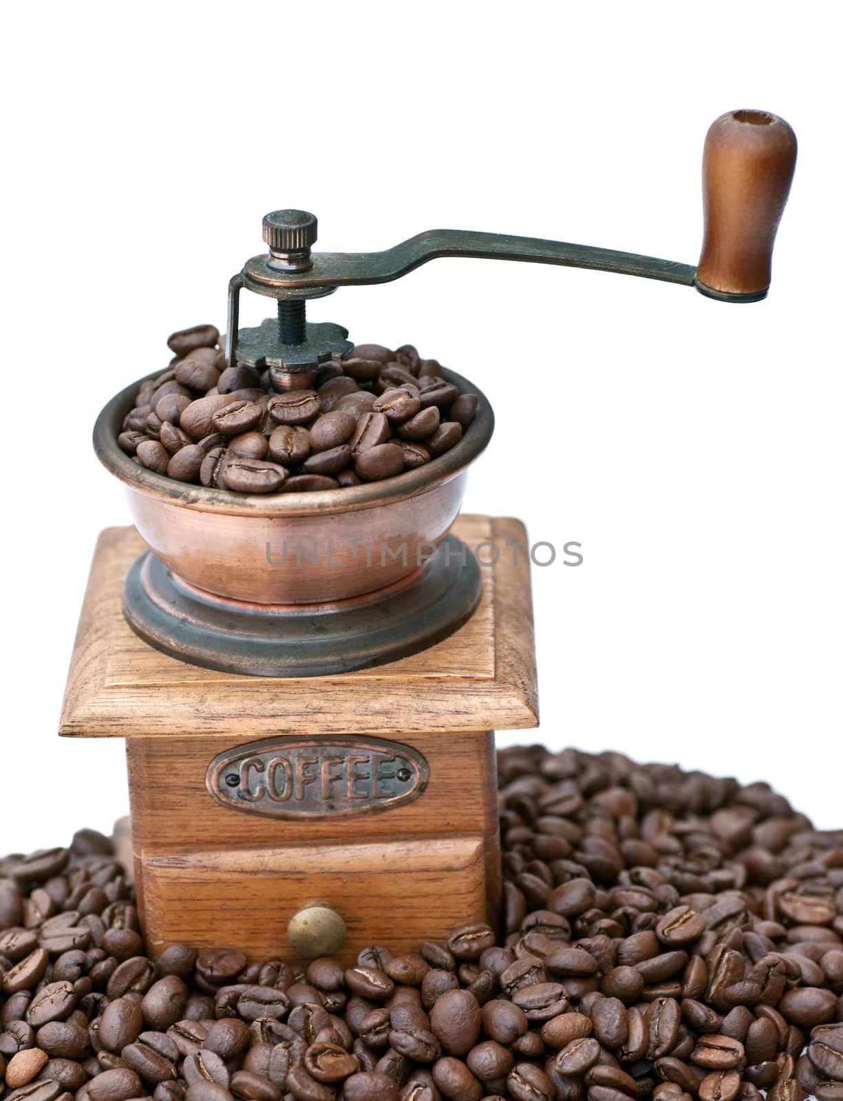 Old coffee grinder with beans