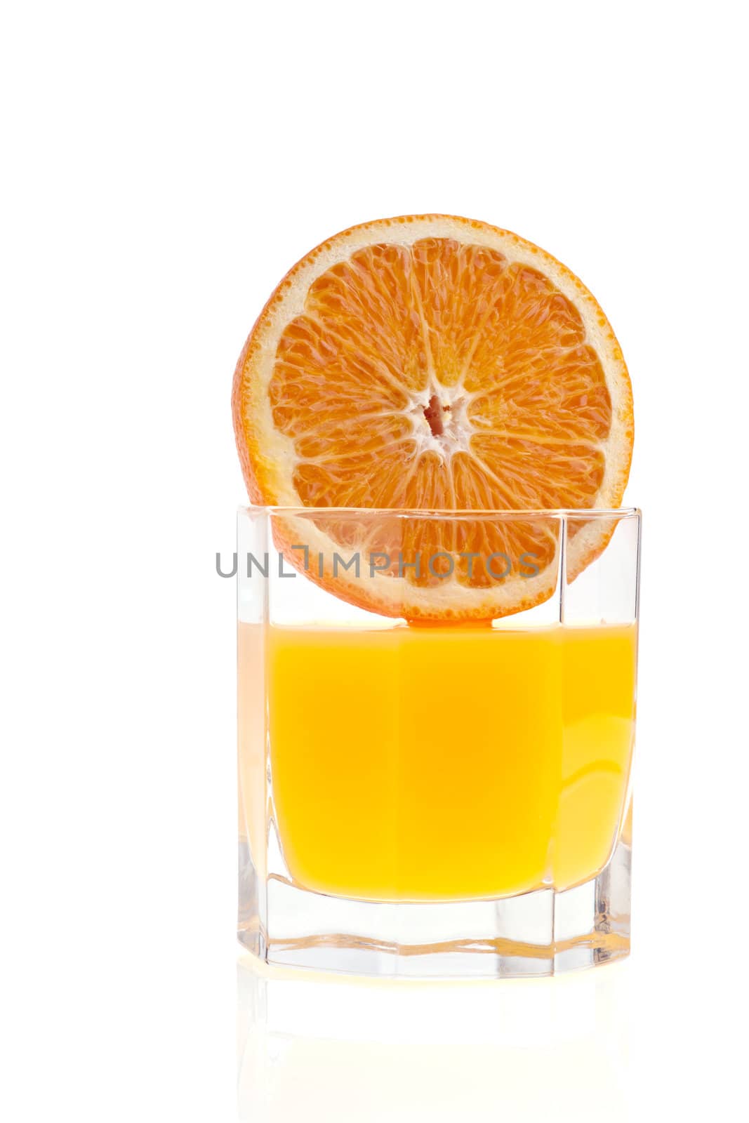 Glass of orange juice, and orange on white background