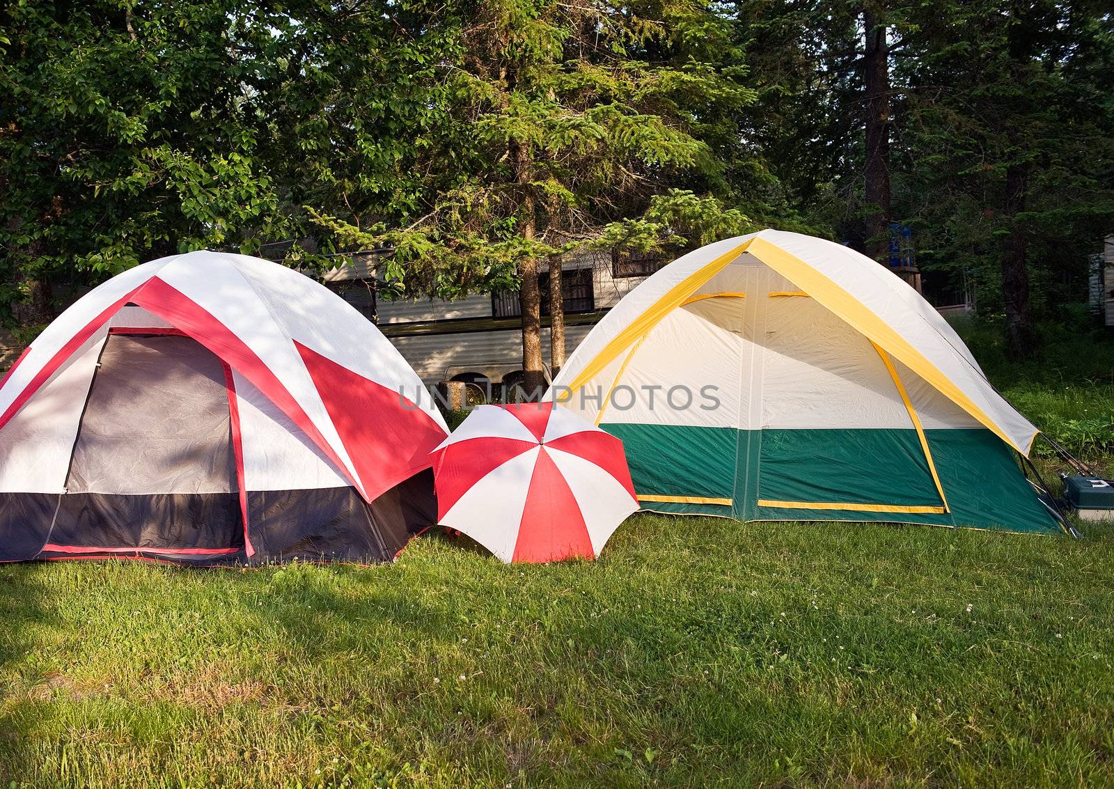 Two tents and umbrella by Marcus