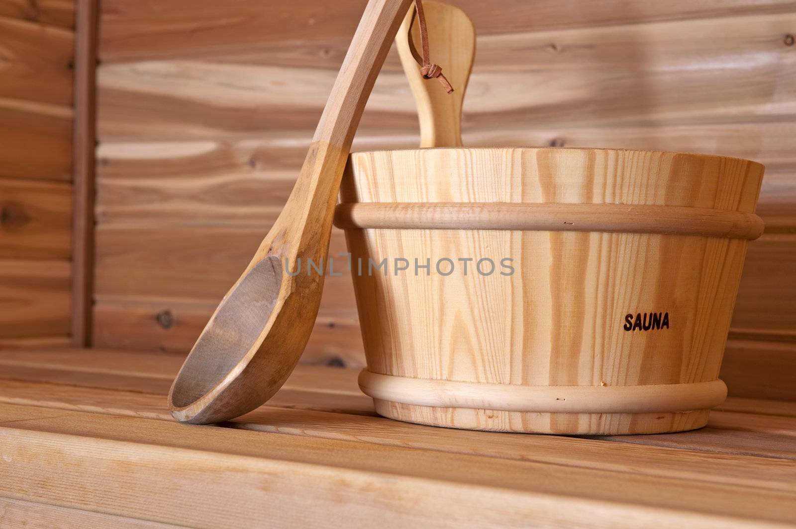 wooden bucket and label within a hot sauna