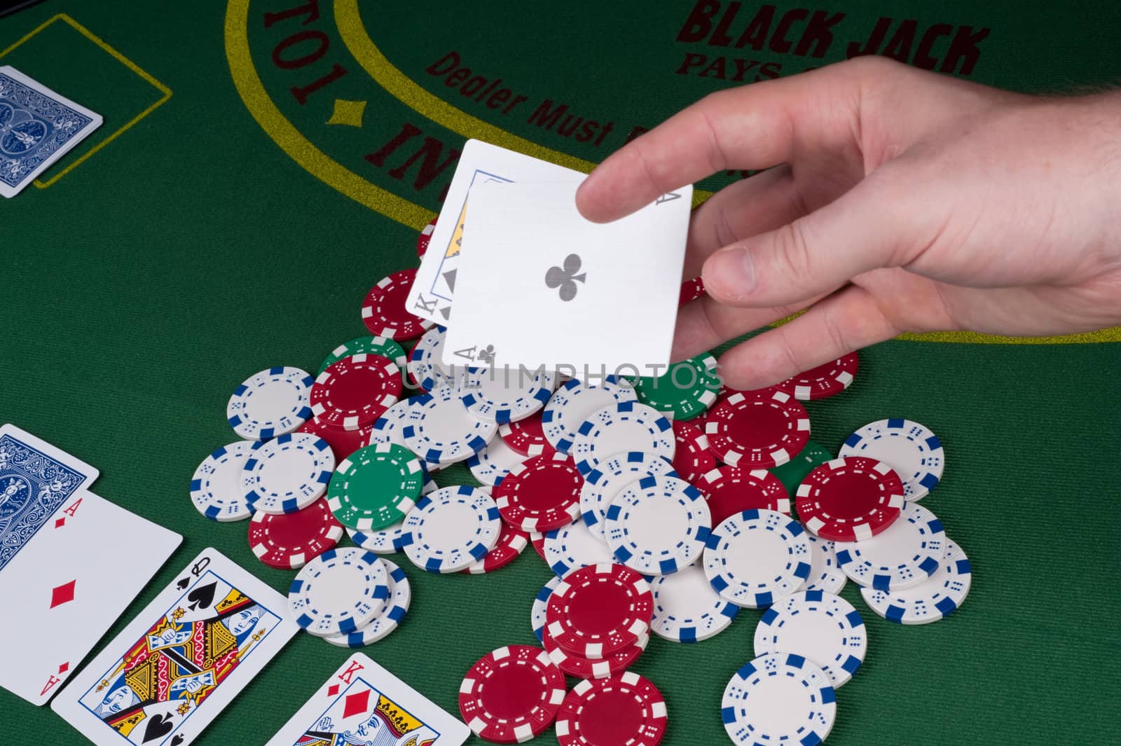 Cards flying over top of a pot of chips