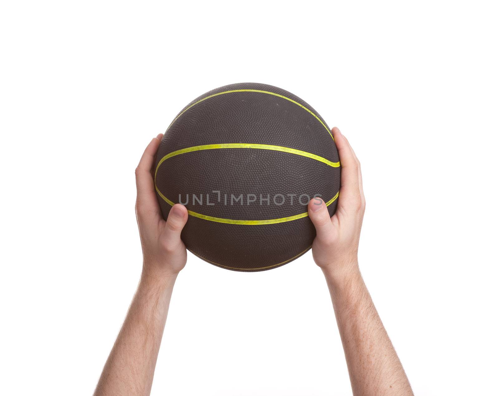 close up of player holding basketball in the air