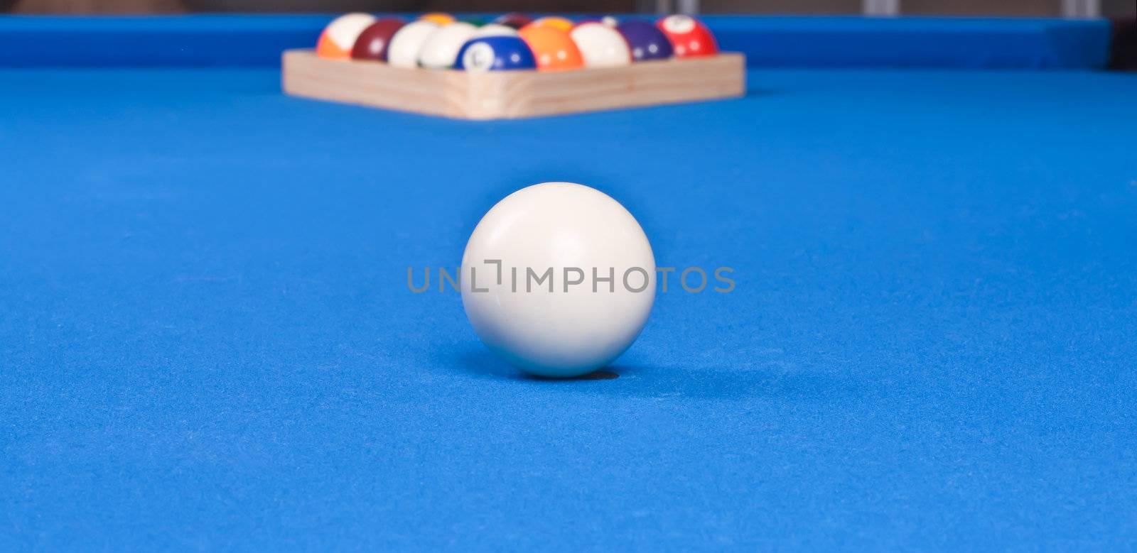 setting up the pool ball table with billiard triangle for first shot
