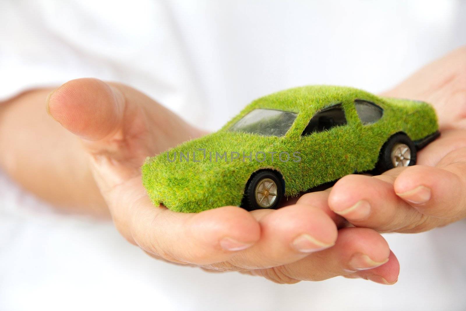 Hand Holding Eco car icon by ponsulak