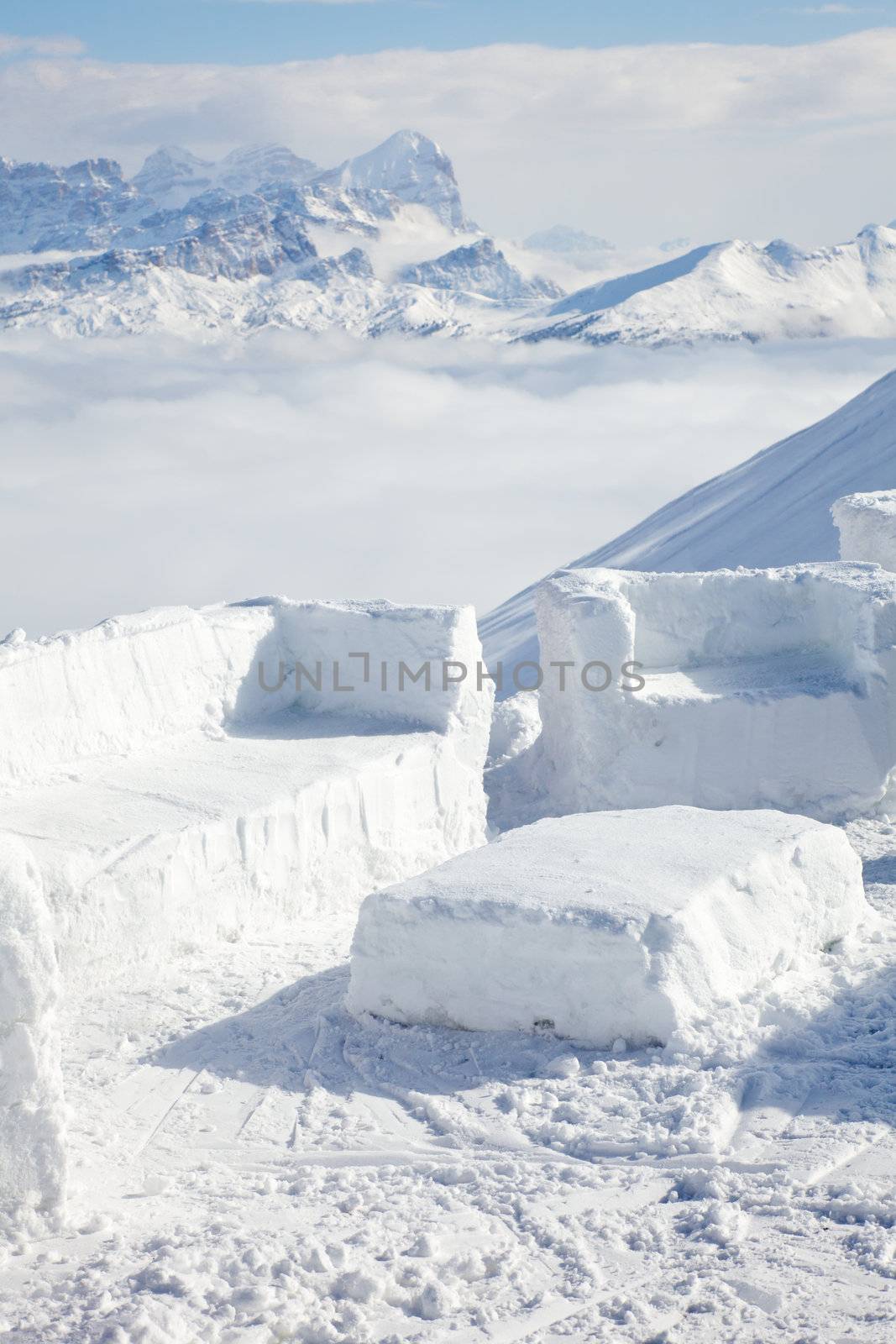 Chairs and table made from snow in Apres Ski bar