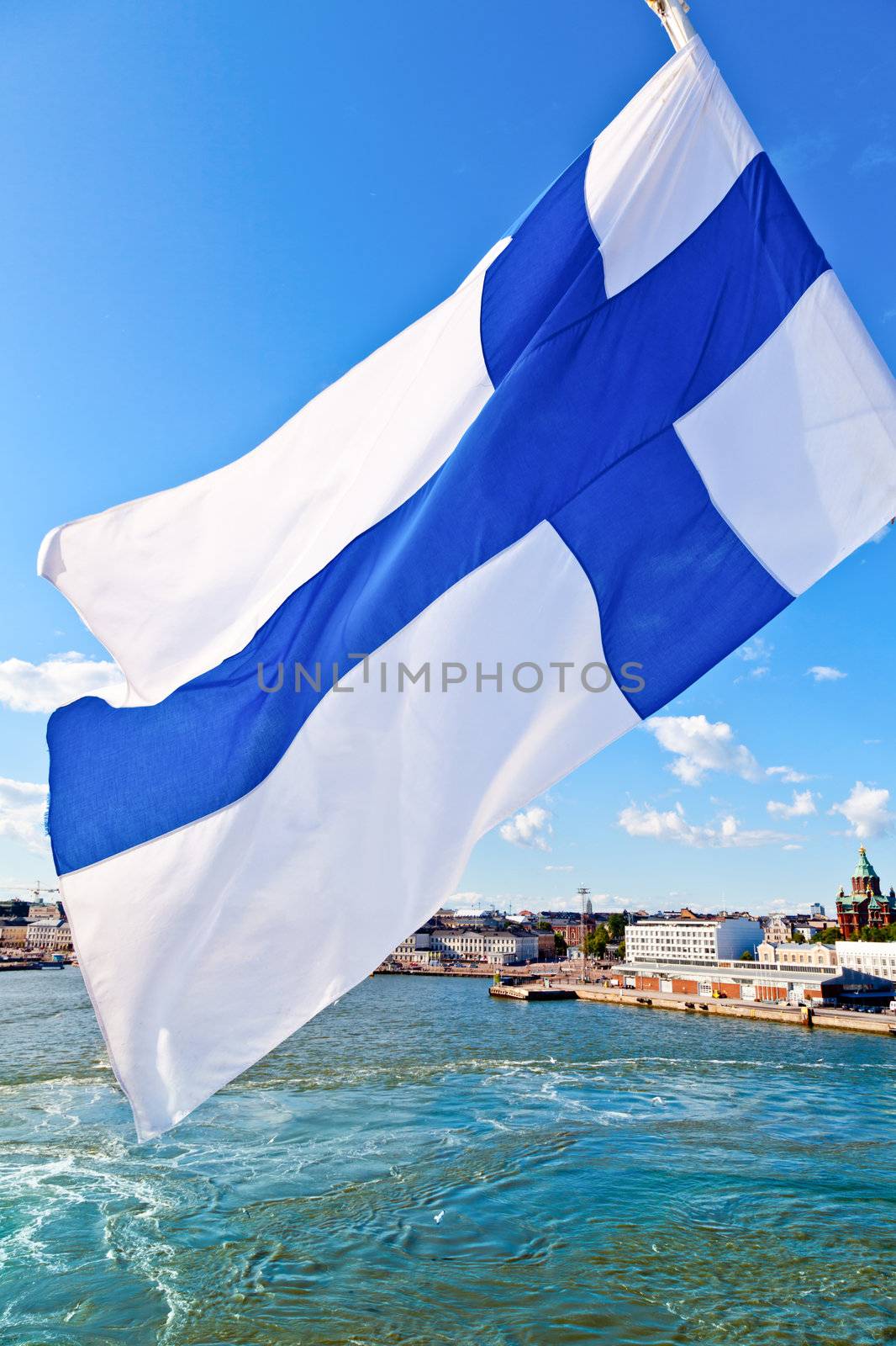 Flag of Finland against Helsinki cityscape