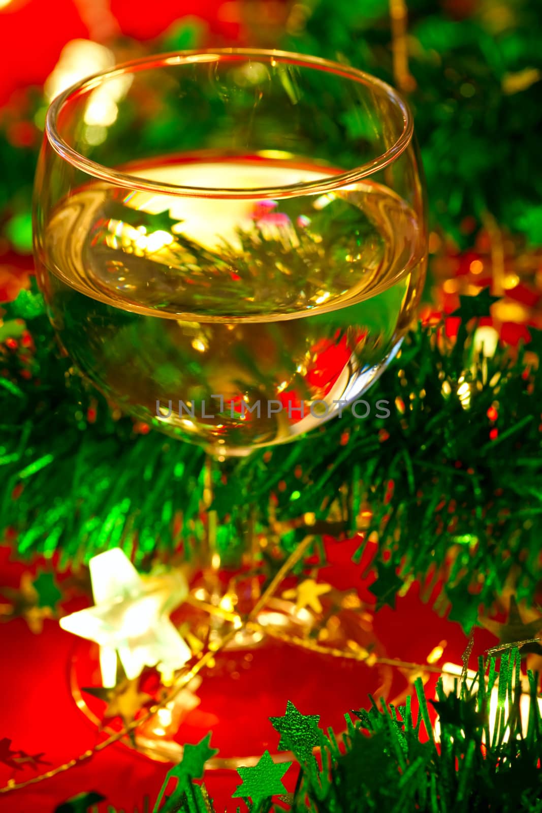 Glass of wine with Christmas decoration by naumoid