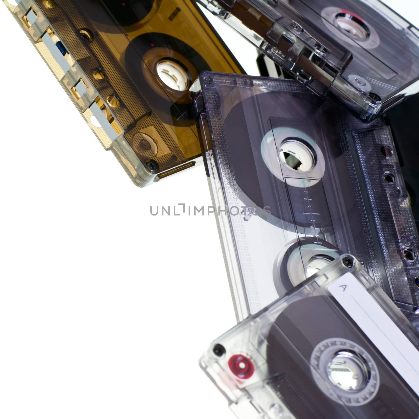 Heap of Compact Cassettes on white background