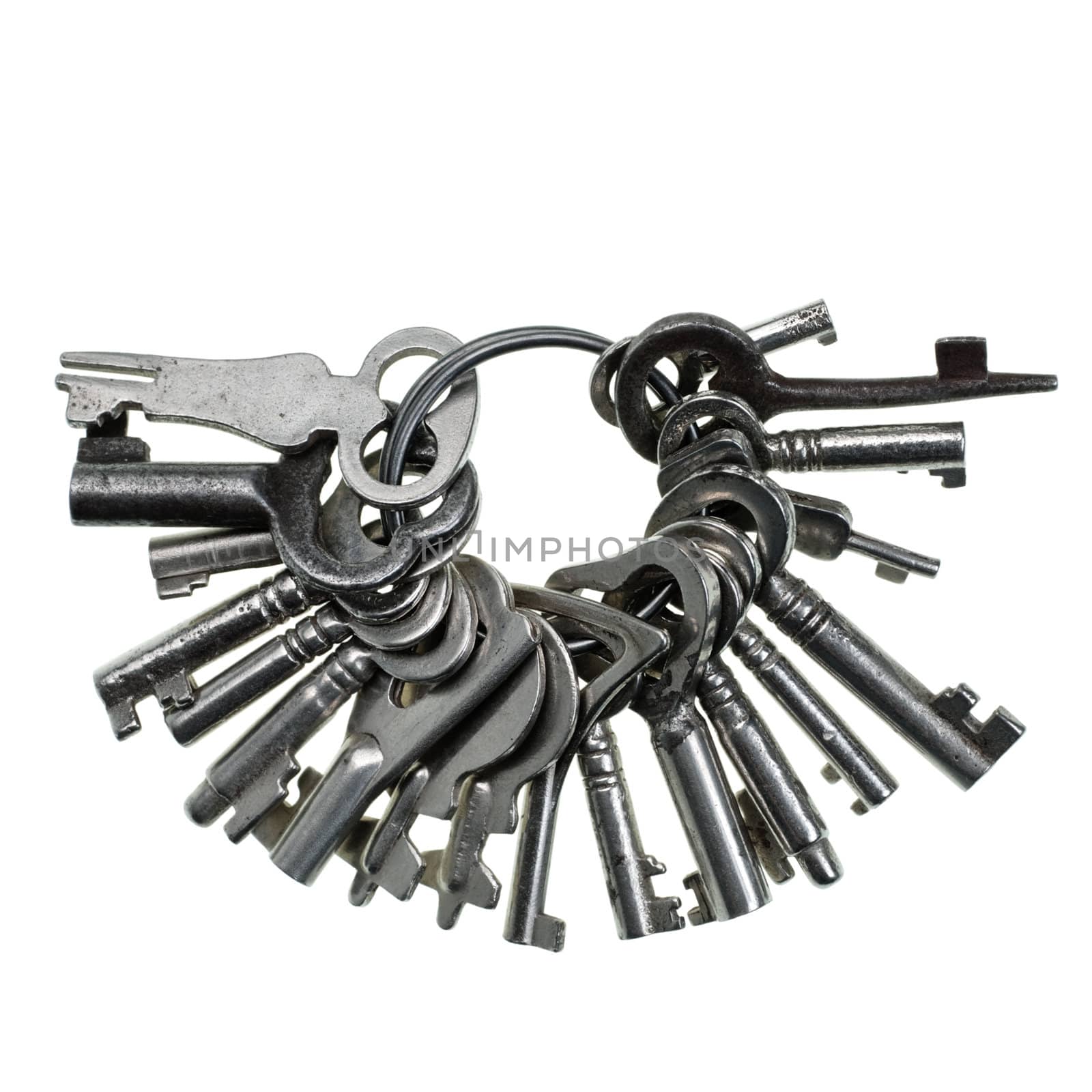 Bunch of small old keys on white background