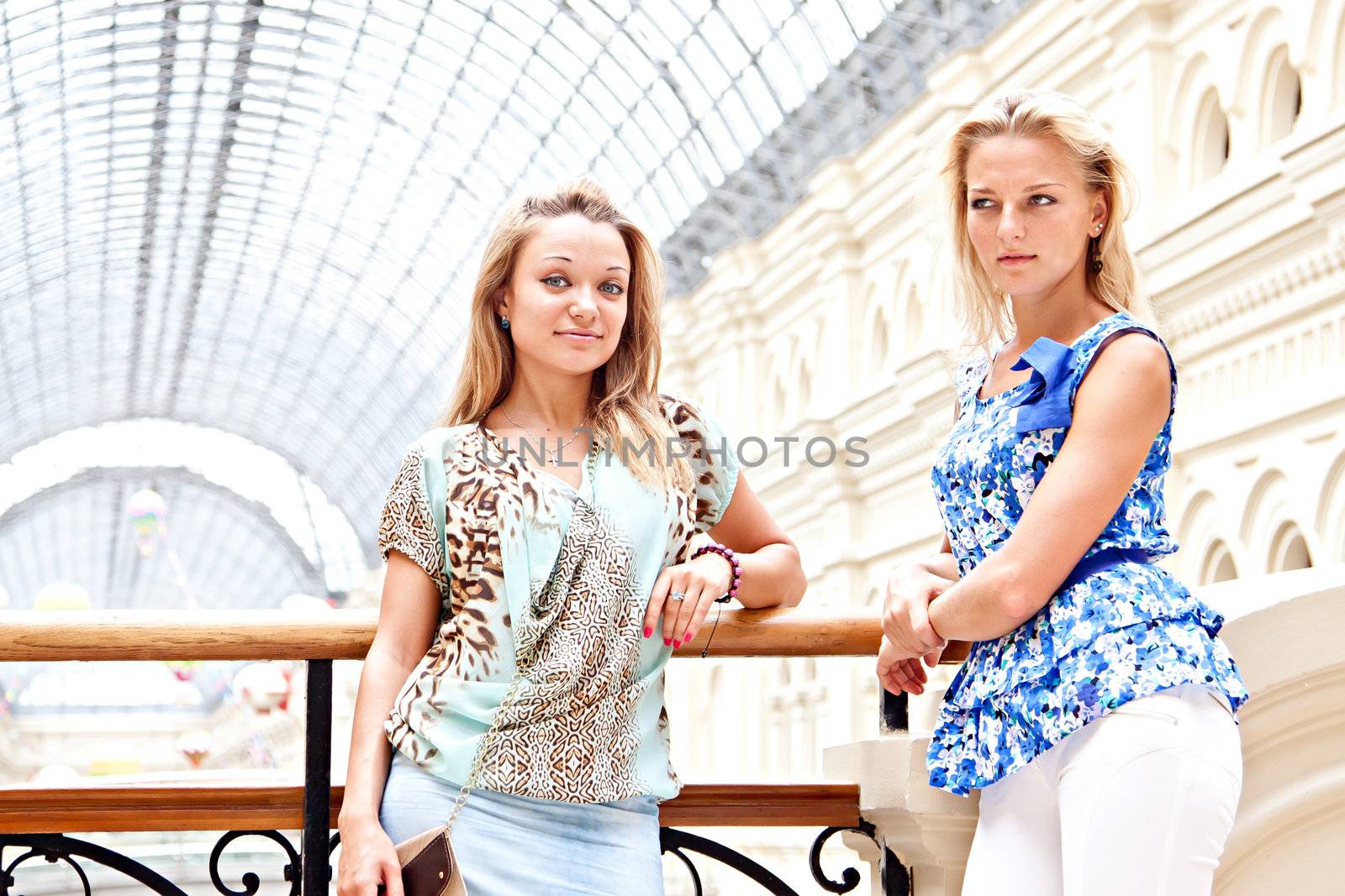 Two women in a shopping center by korvin79