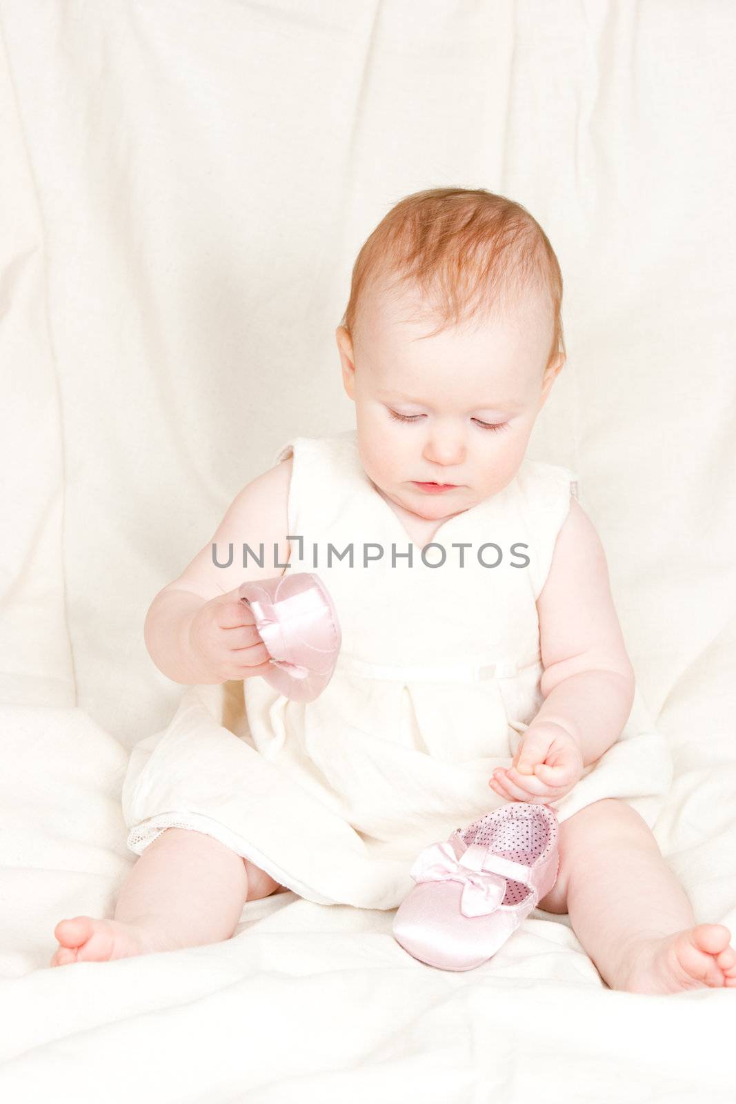 Infant with shoes by naumoid