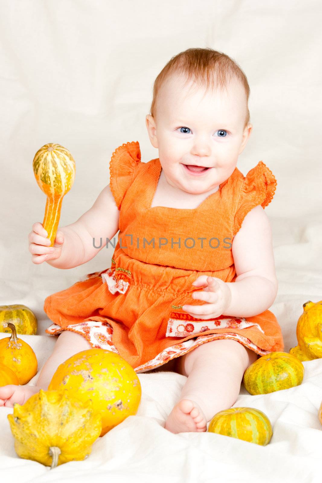Infant with pumpkin by naumoid