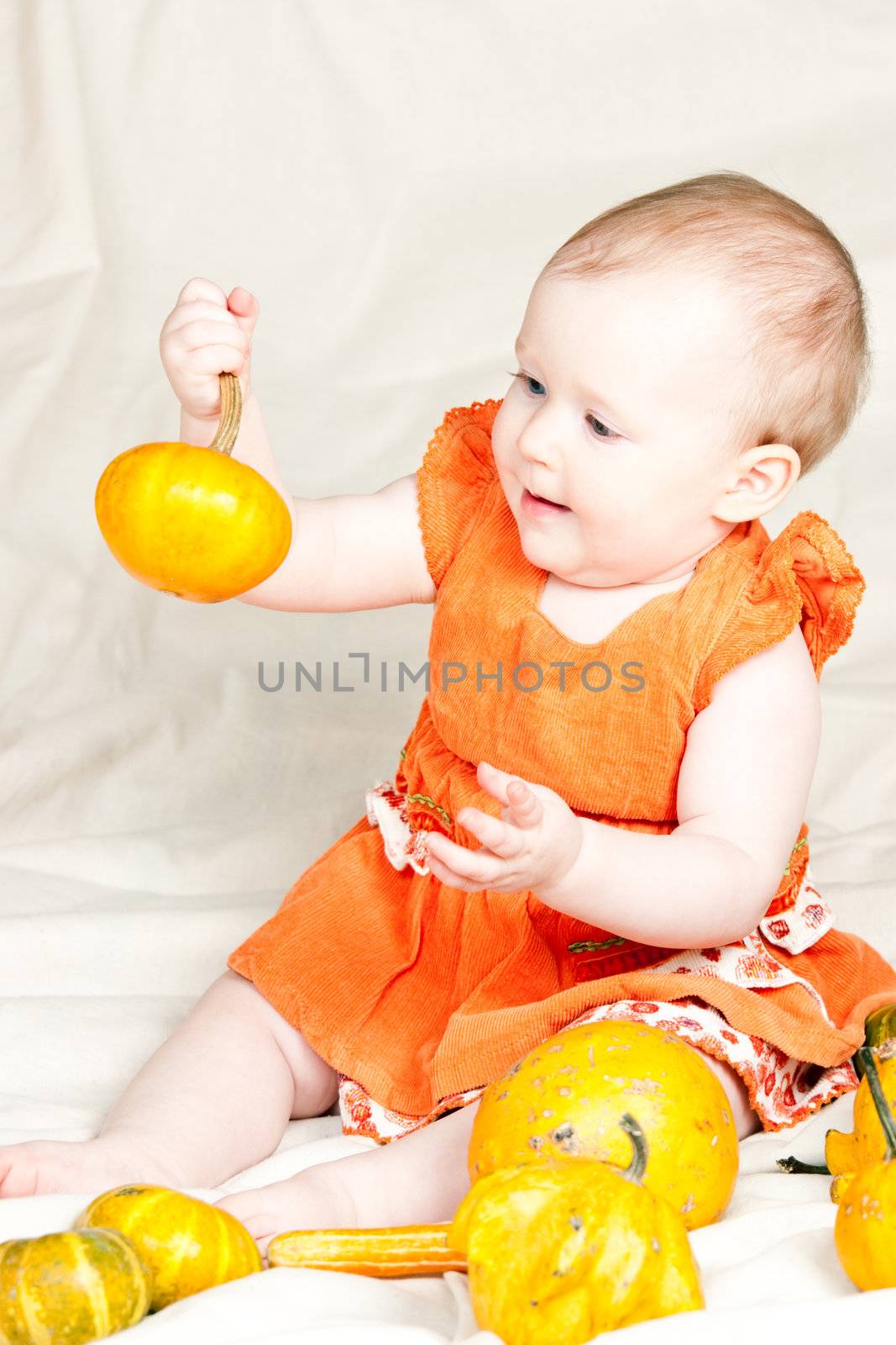 Infant with pumpkin by naumoid