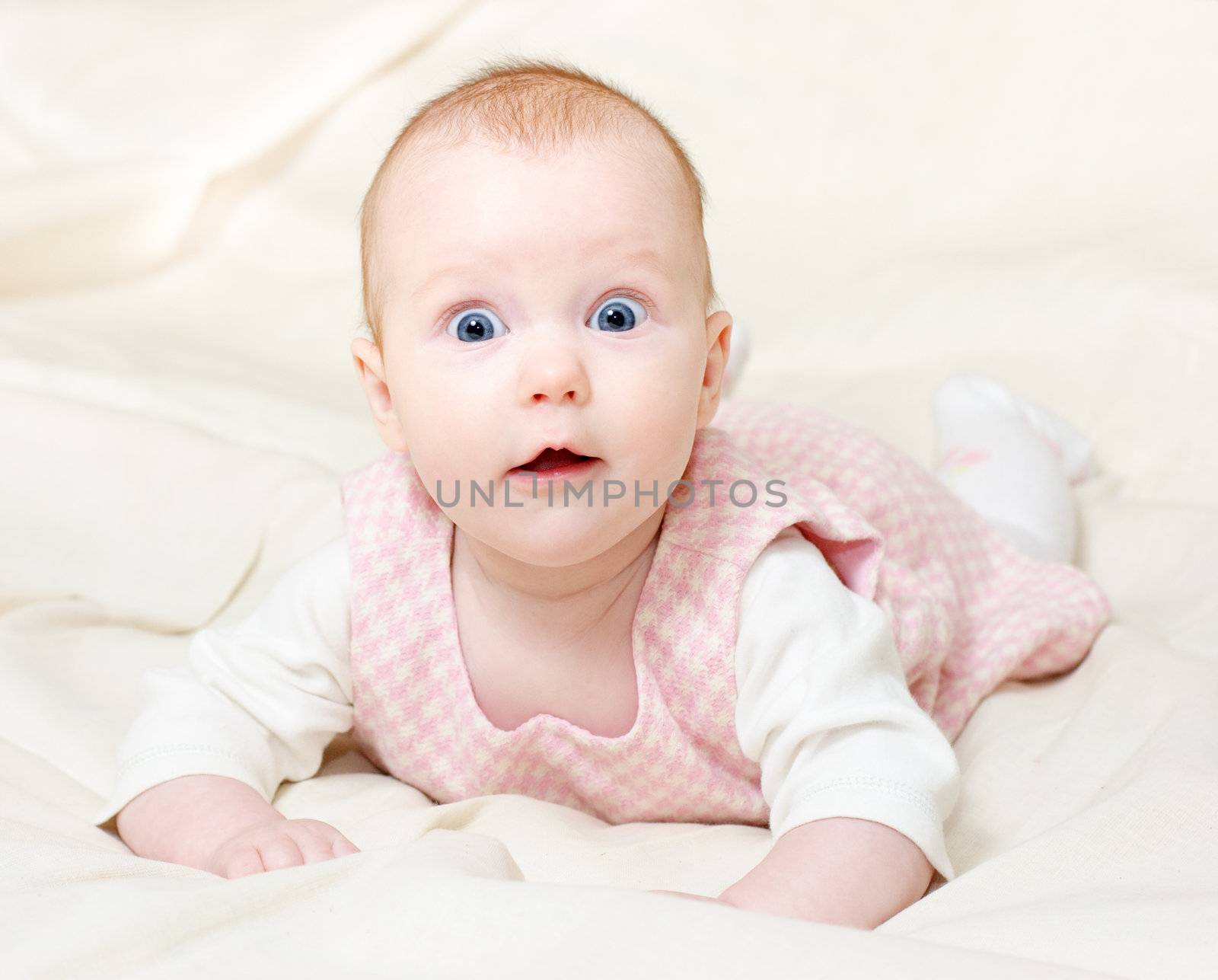 Portrait of surprised four month baby girl
