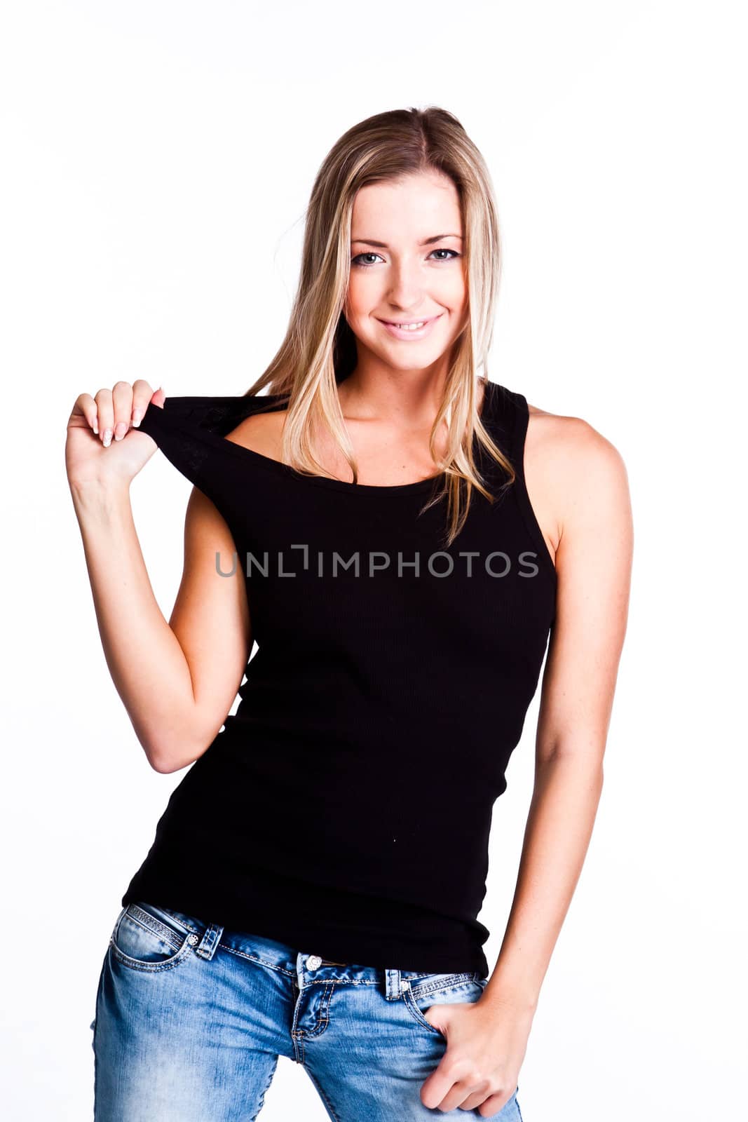 Young, beautiful and happy woman in a black shirt and blue jeans