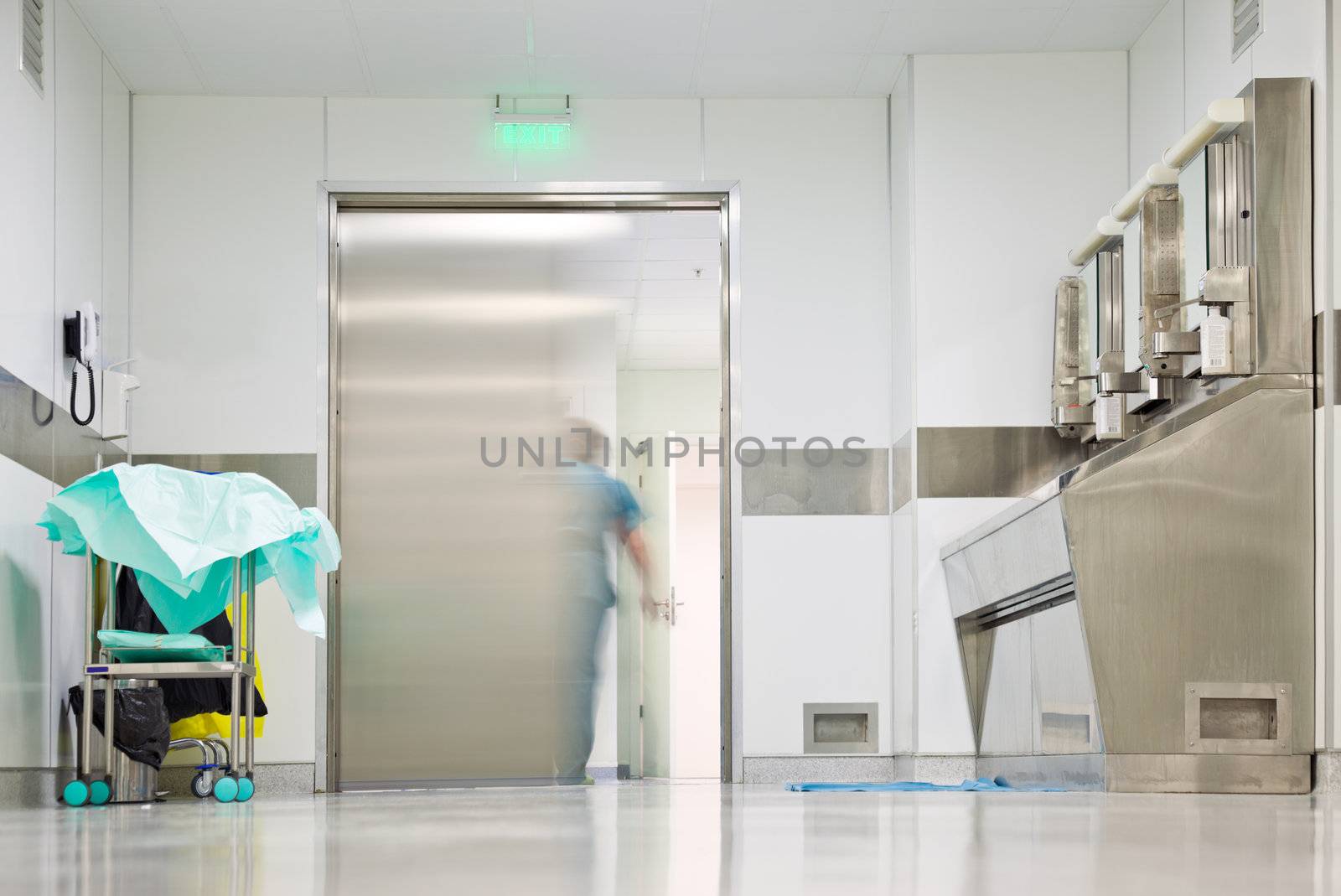Blurred figure exiting hospital door by vilevi