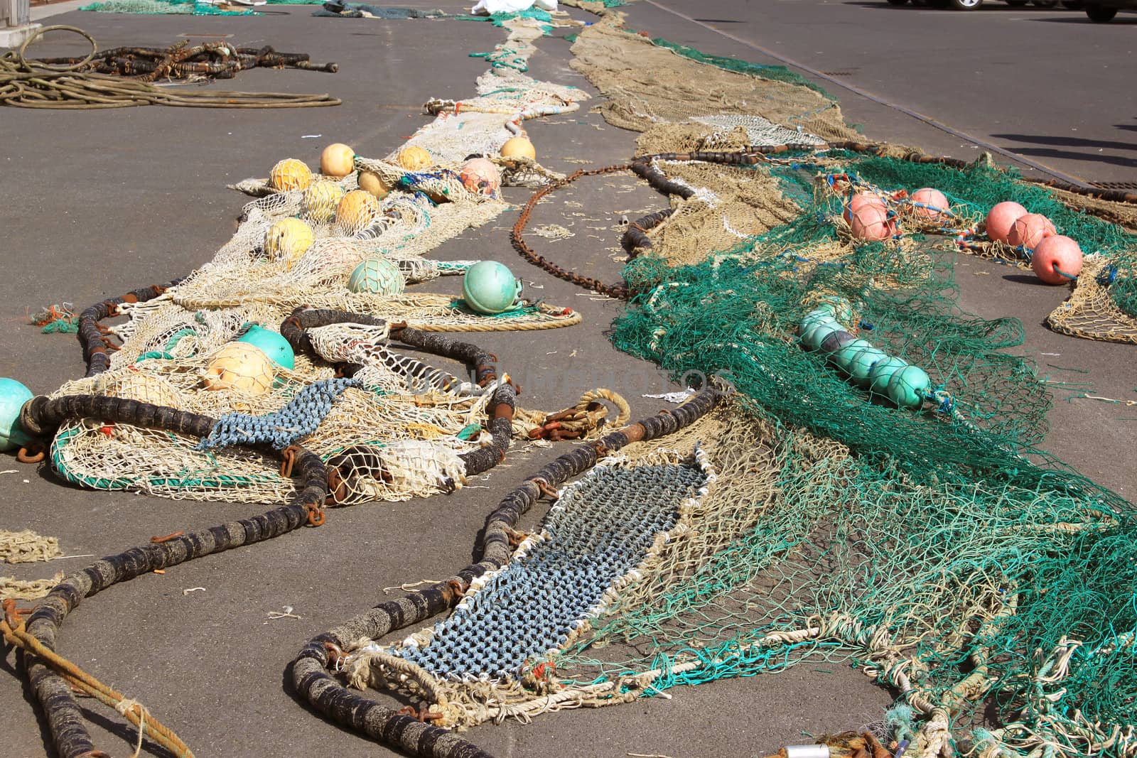 fishing nets lying on the ground for drying