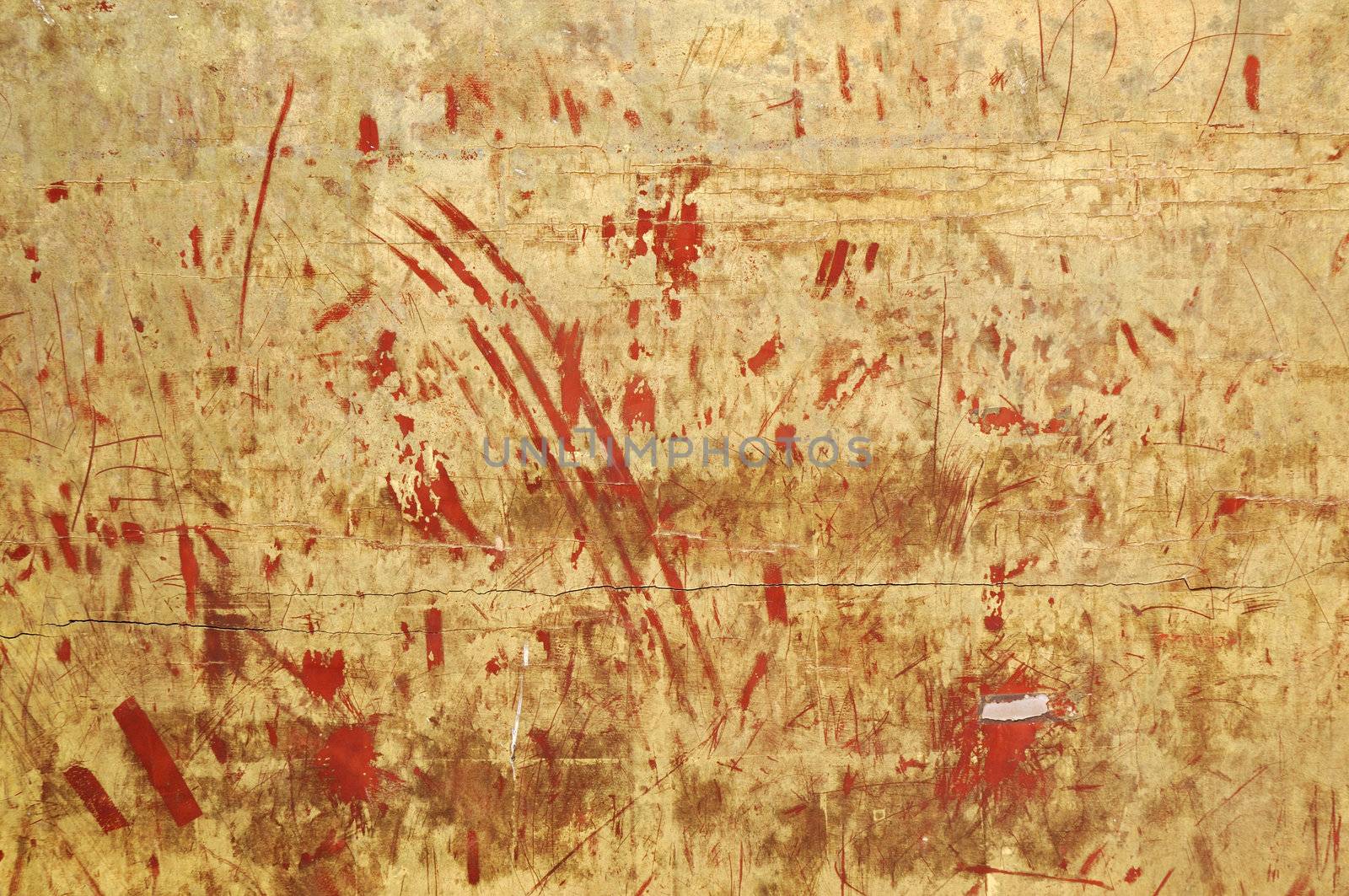 ancient temple wall background with scratched golden color over old red painting