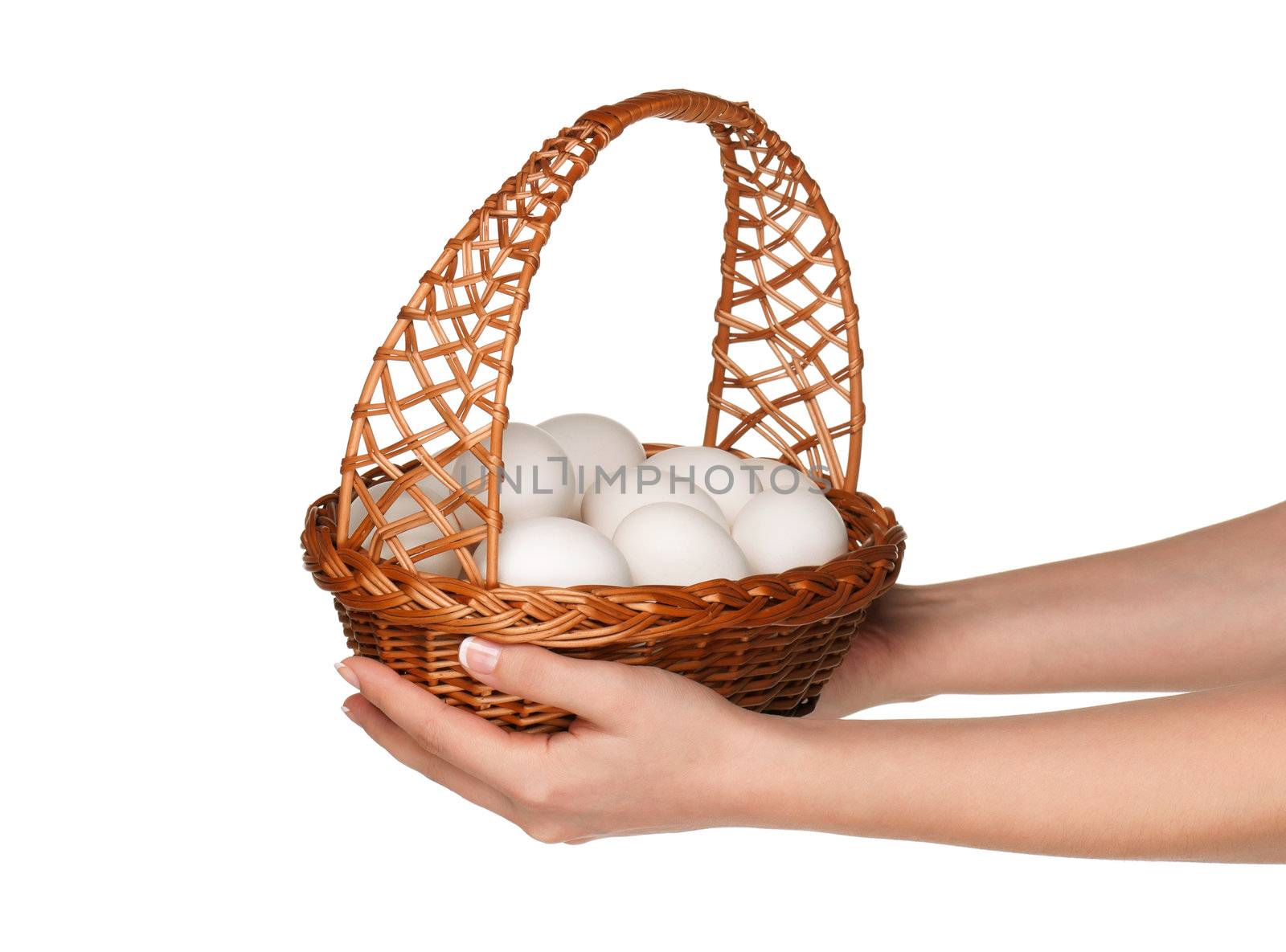 Basket with eggs in woman hand isolated on white background