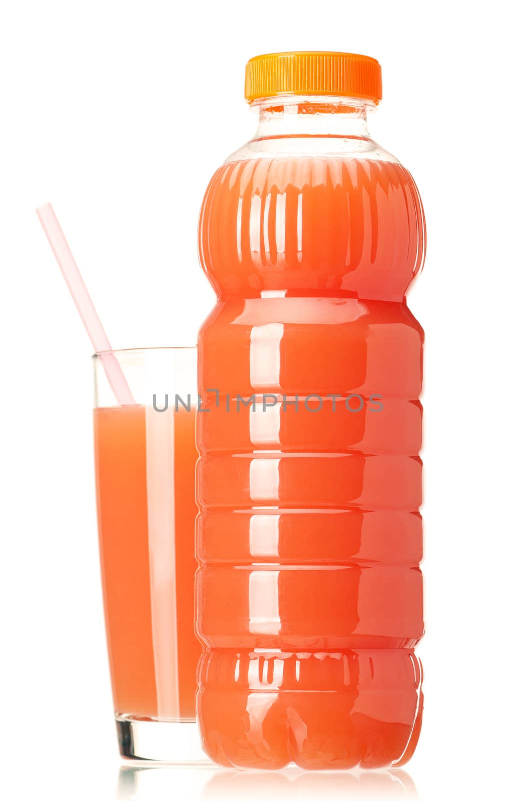 Grapefruit juice in plastic bottle and glass on white background