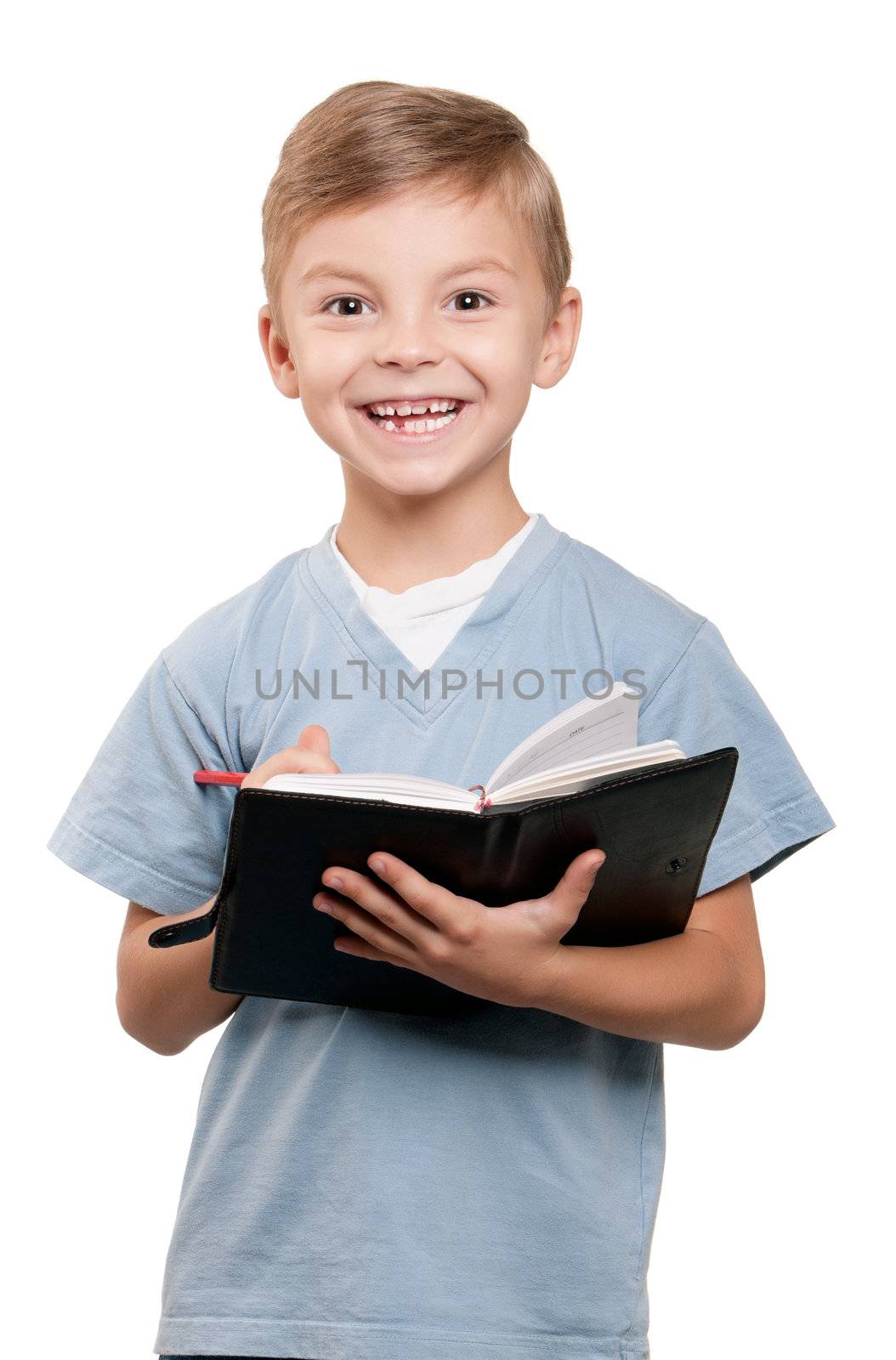 Portrait of a funny little boy holding a books over white background