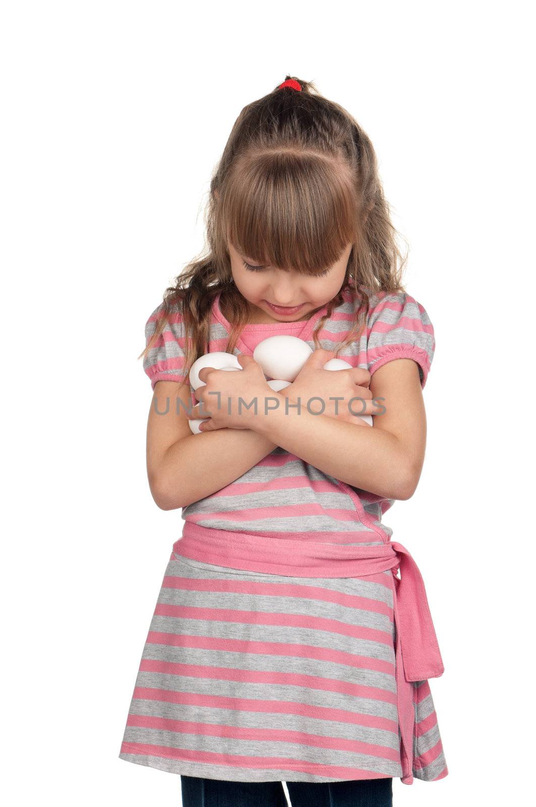 Happy little girl holding eggs over white background