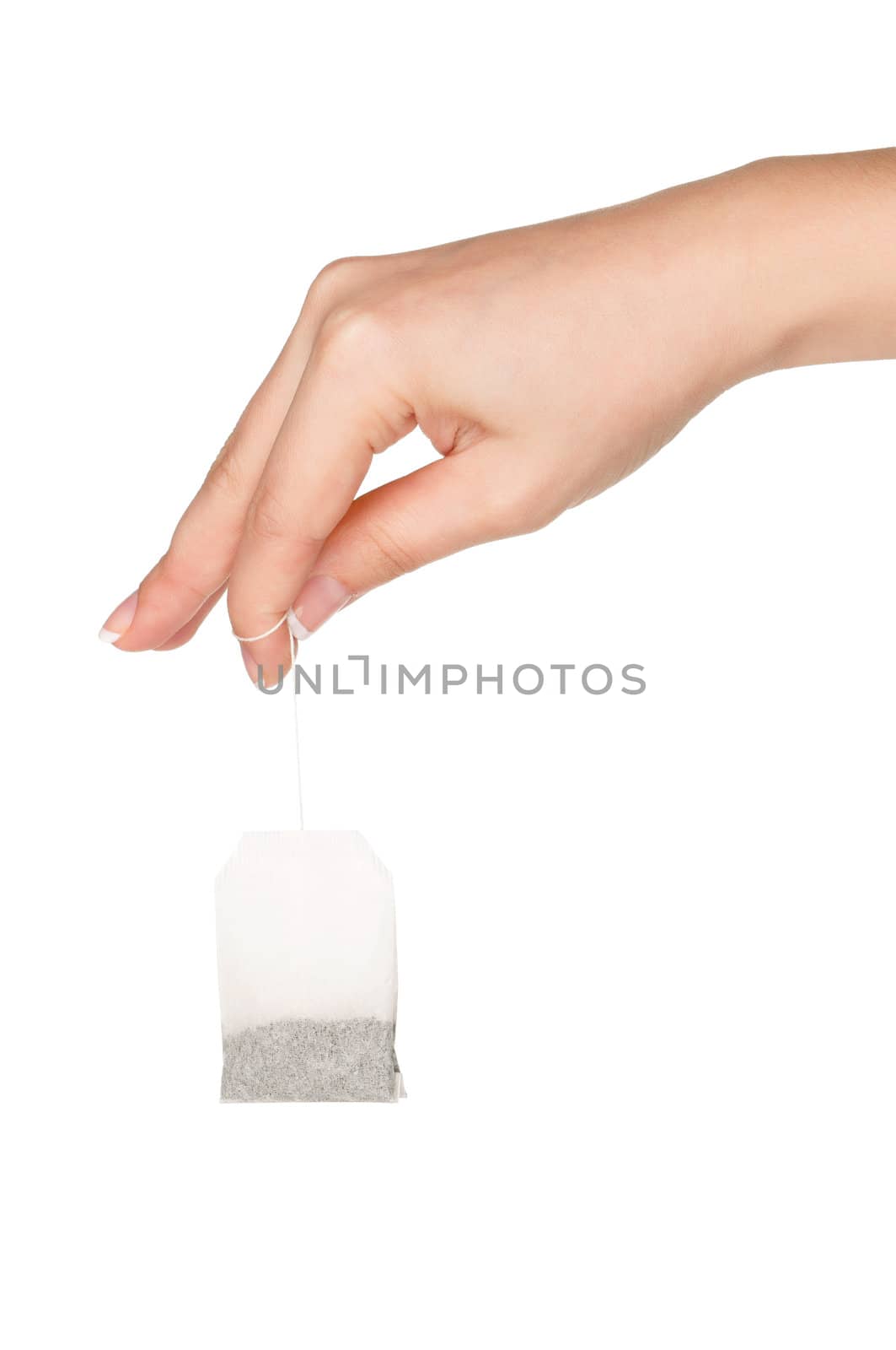 Woman hand with teabag isolated on white background