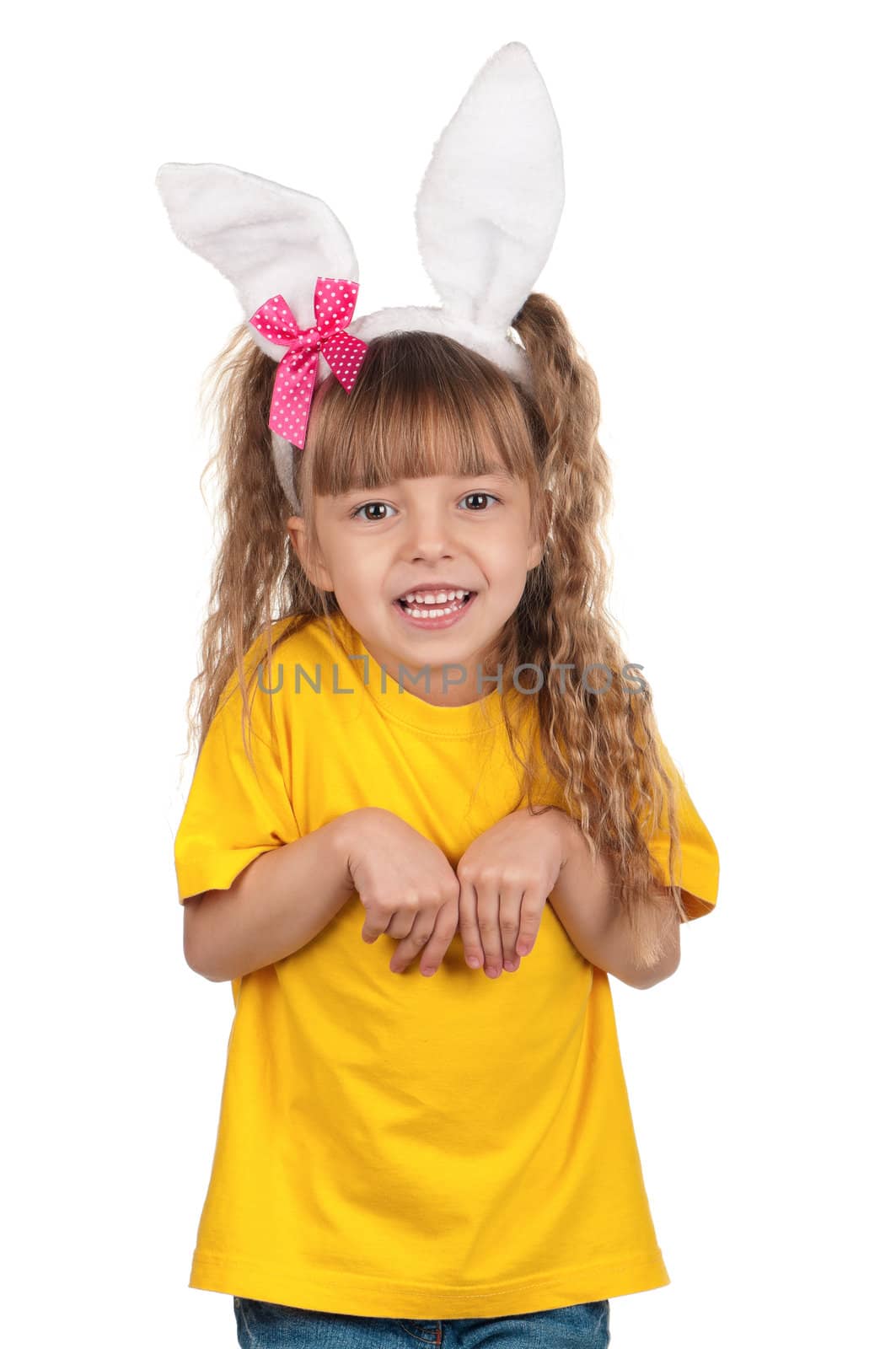 Portrait of happy little girl with bunny ears over white background.