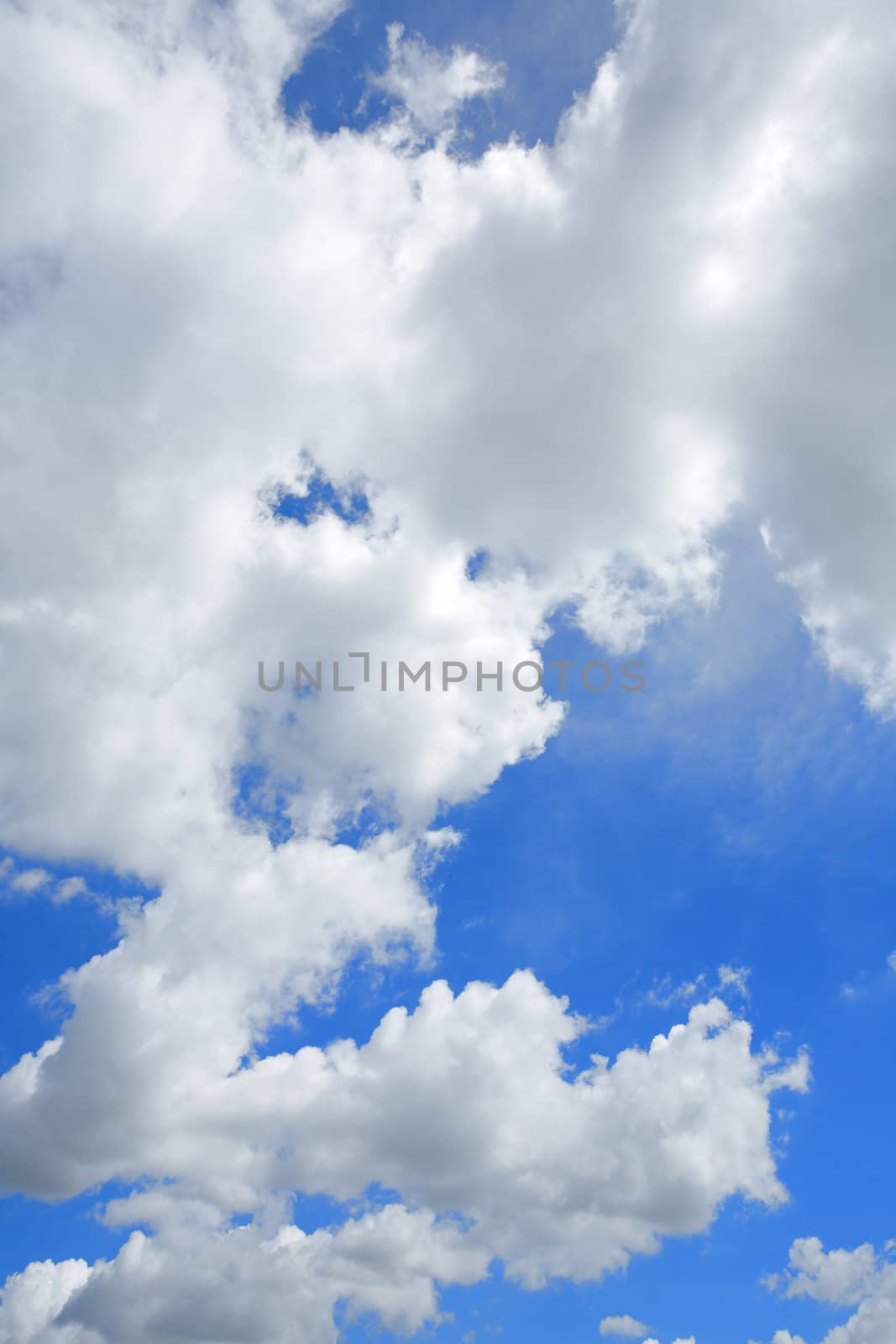 white fluffy clouds in the blue sky by antpkr