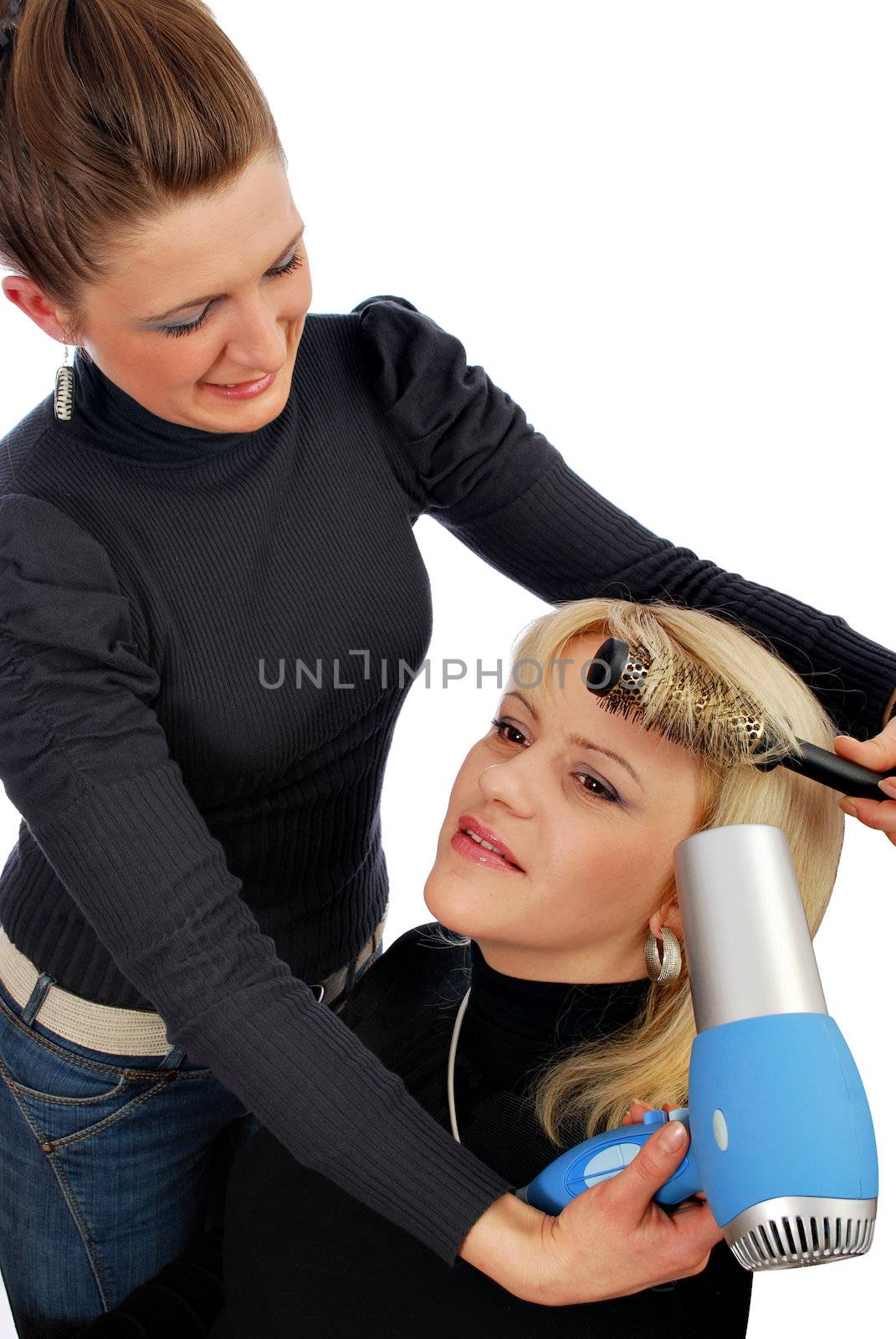 Two girls in hair-dress salon drying hair by goce
