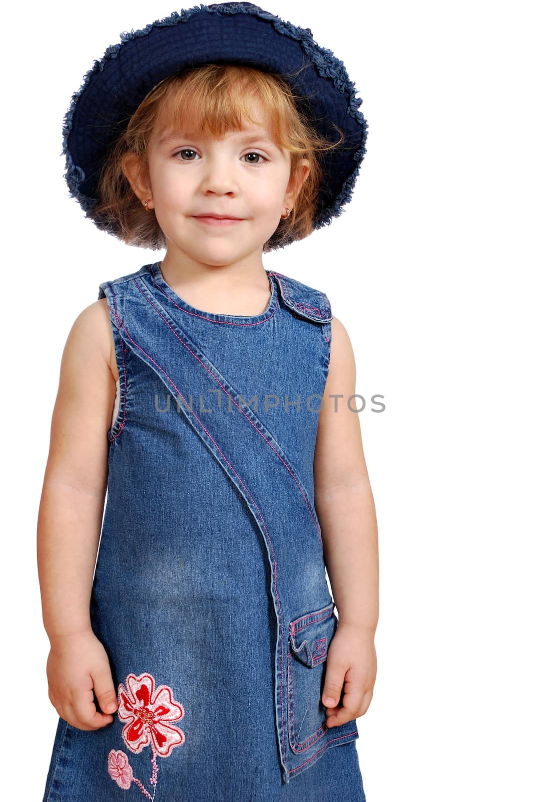 Little girl with blue jeans hat and dress studio shot