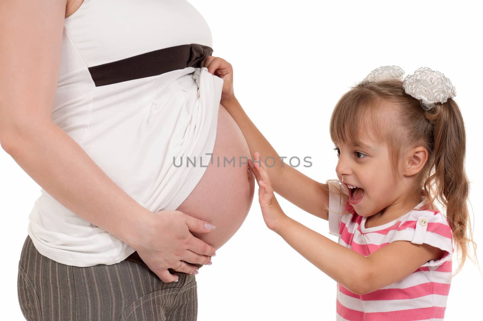 Pregnant woman with her daughter - isolated over a white background. Third trimester.